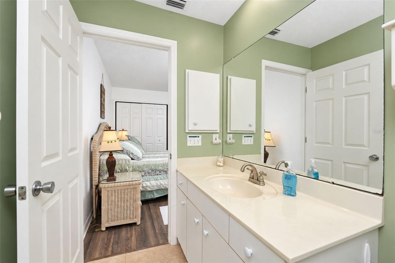 The vanity has a cultured marble countertop and updated faucet. - 4260 PLACIDA RD #9C, ENGLEWOOD