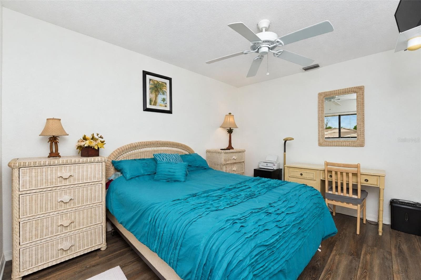 The guest bedroom has new laminate flooring, a ceiling fan and a wall closet. - 4260 PLACIDA RD #9C, ENGLEWOOD