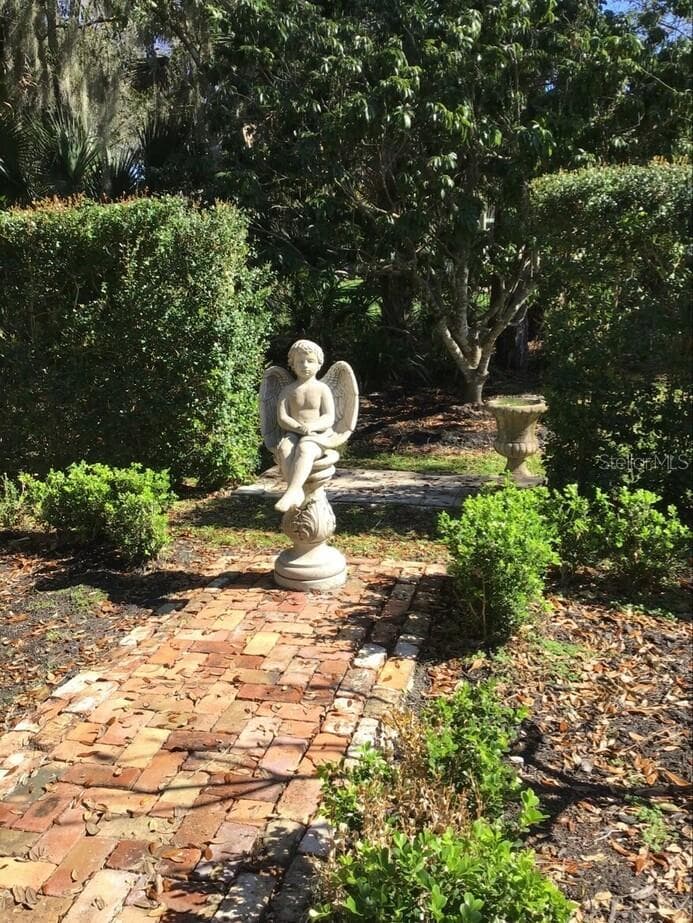 Antique Chicago Brick used in the Masterpiece Formal Garden. Large Lychee Tree is seen here - 3171 DICK WILSON DR, SARASOTA