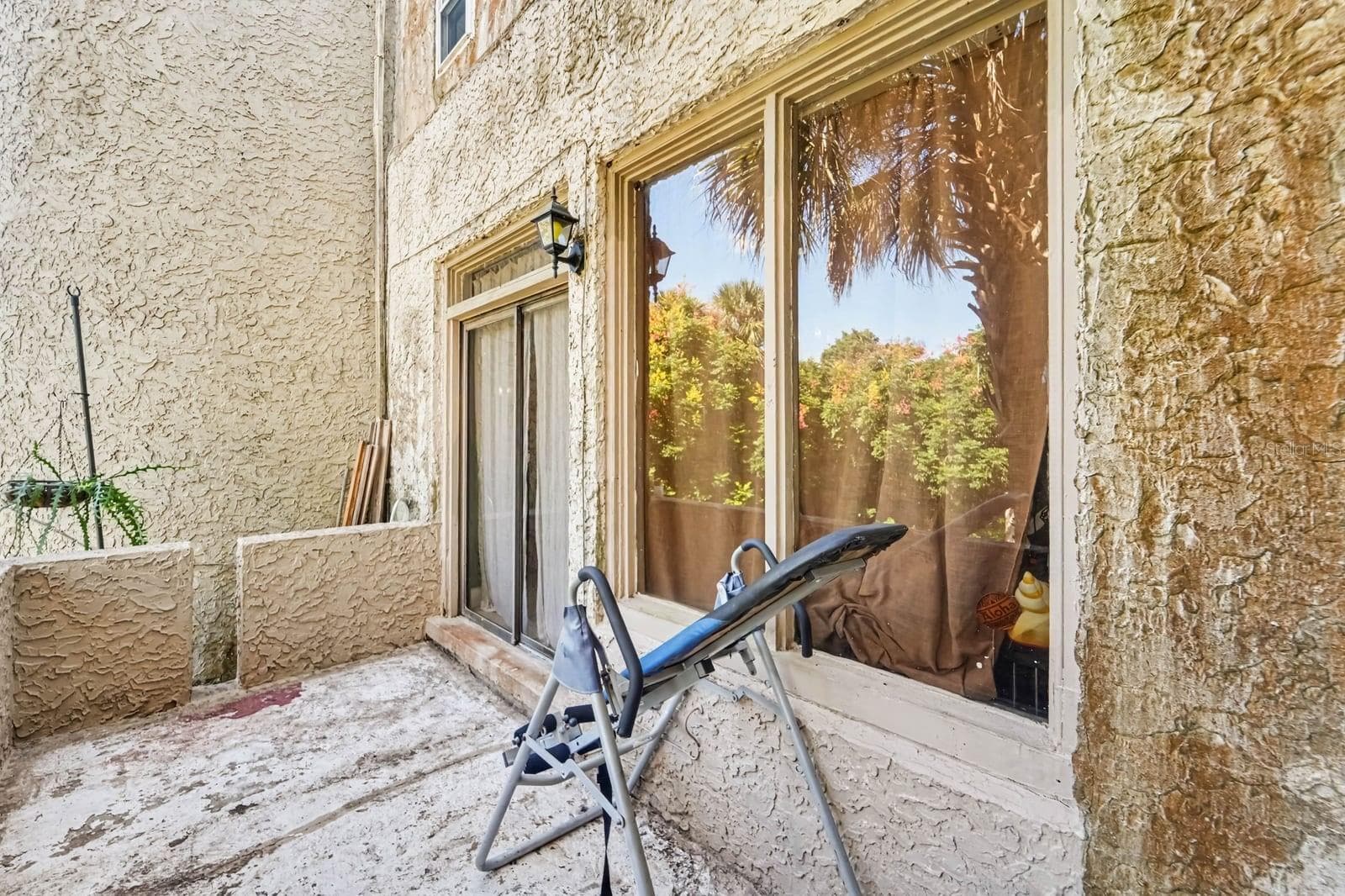 Rear Patio Access through Glass Doors Overlooking Lush Grounds - 1055 ENCOURTE GREEN, APOPKA