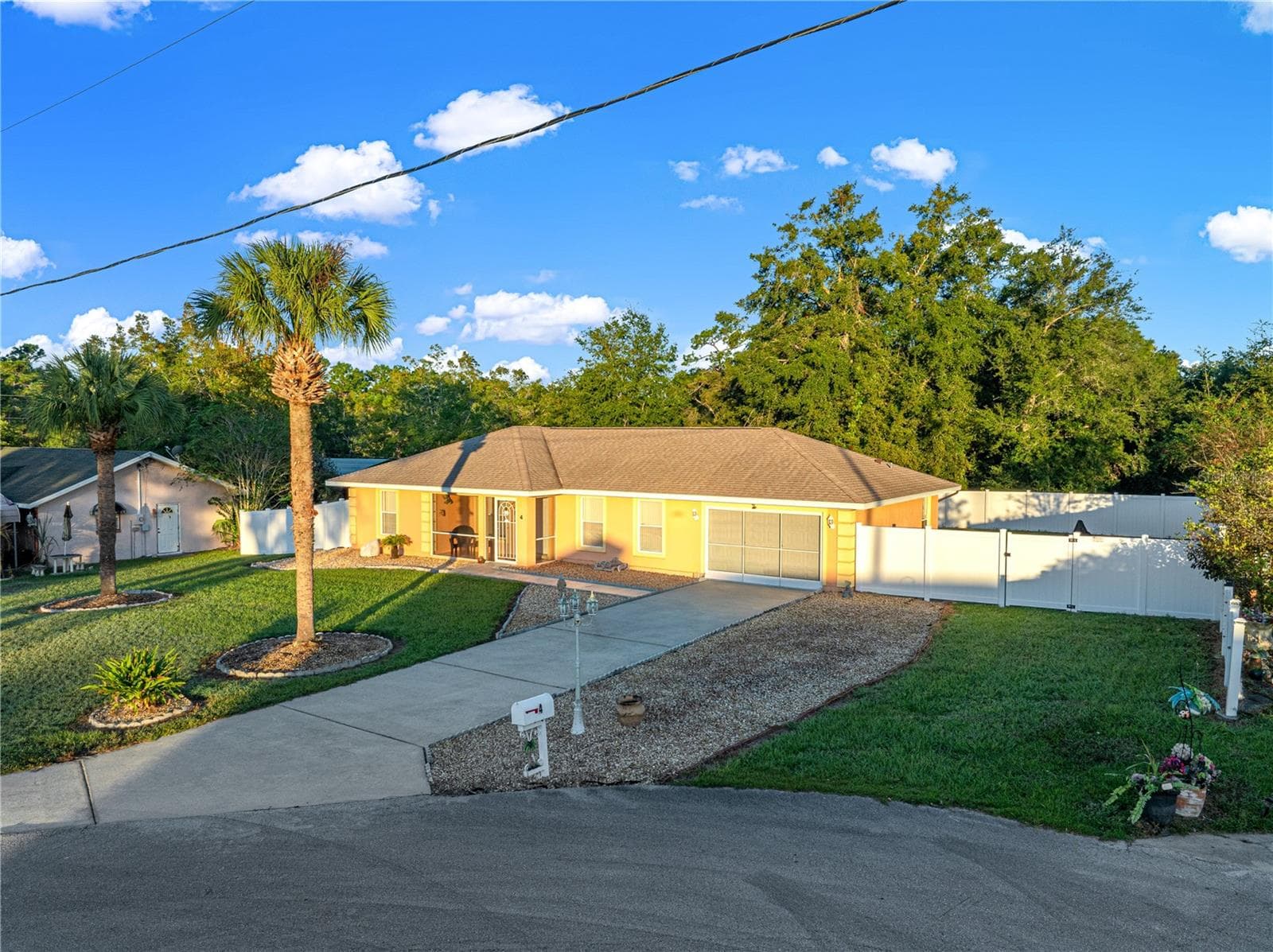 garage and parking front view - 4 CEDAR TRACE PASS, OCALA