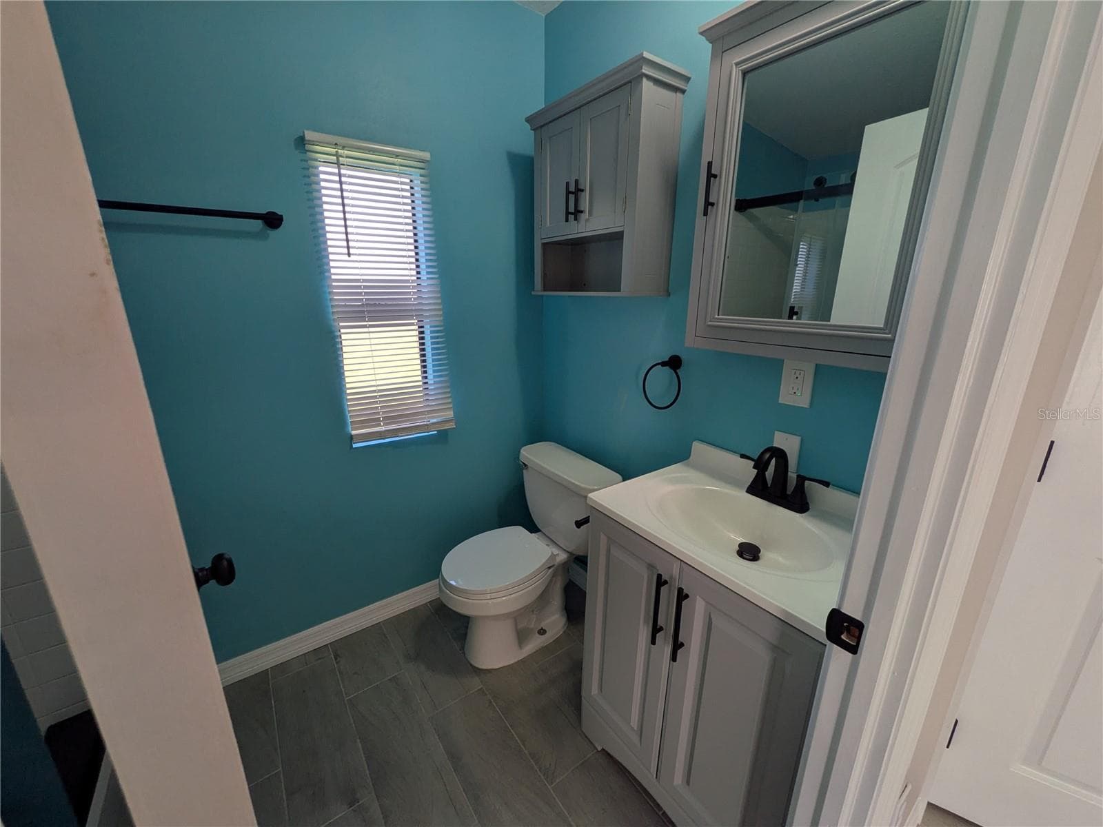 PRIMARY BATHROOM VANITY & COMMODE - 3125 BAYBERRY AVE, PUNTA GORDA