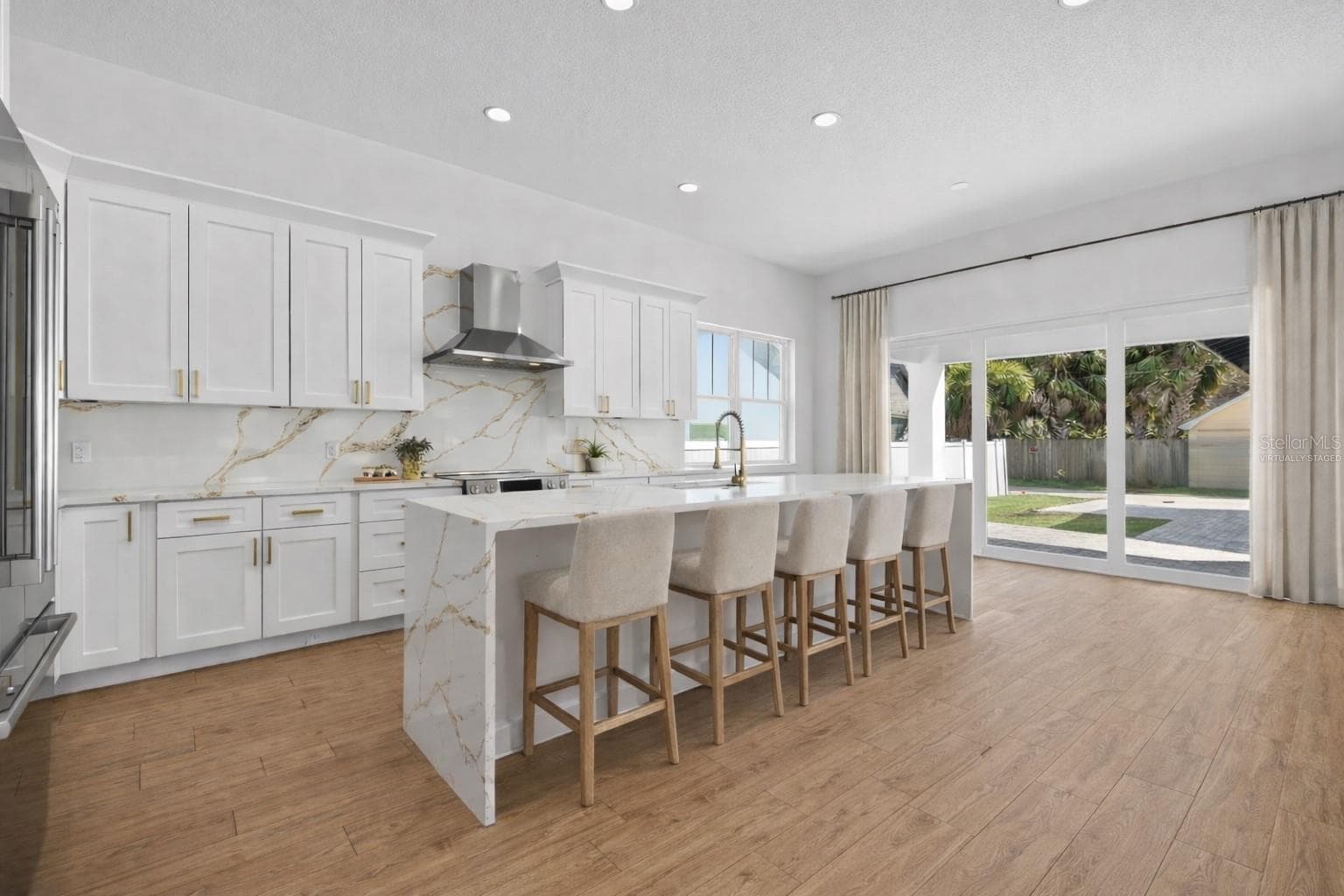 Generous kitchen with waterfall quartz countertop island (virtually staged) - 842 30TH AVE, ST PETERSBURG