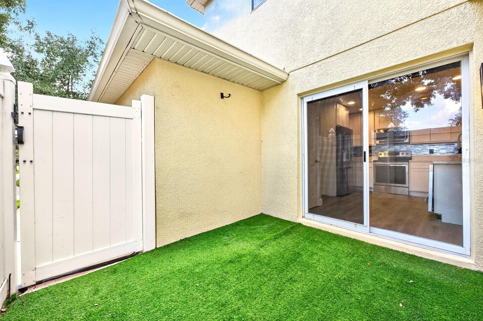 Enjoy your own PRIVATE PATIO just off the Kitchen, offering a pleasant spot for morning coffee, outdoor dining or relaxing at the end of the day. - 13028 AUBURN COVE LN, ORLANDO