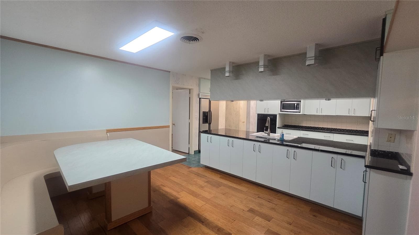 Eat in kitchen. Table was custom made to push in to the corner for buffet/entertainment/party - 10386 112TH WAY N, SEMINOLE