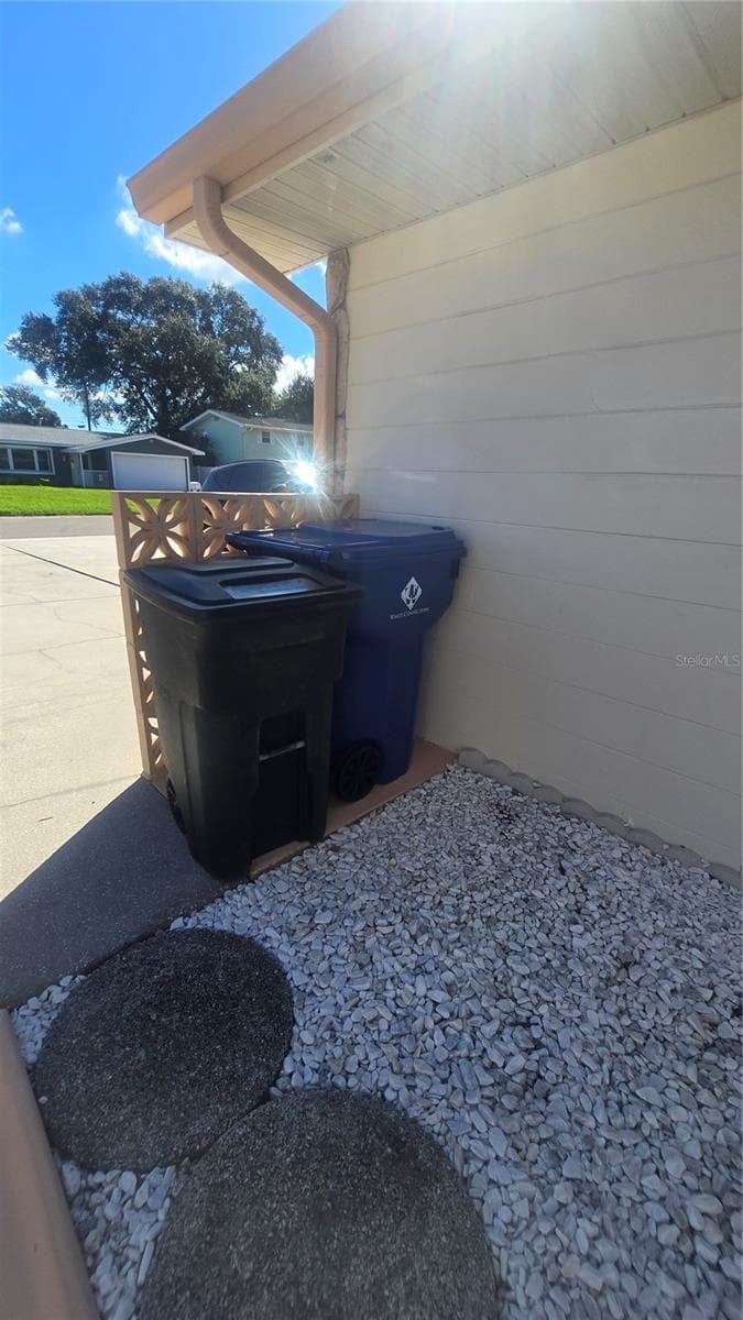 Side of the house features a place for the trash can and recycle can - 10386 112TH WAY N, SEMINOLE