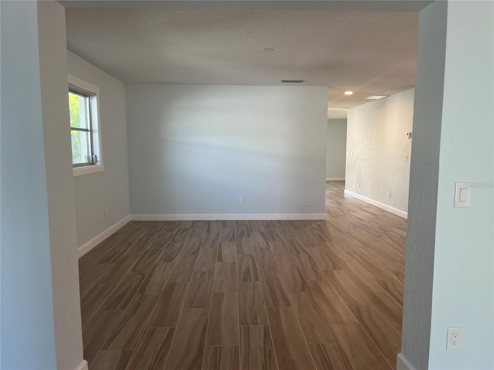 Heading towards the dining and living area - 307 LA HACIENDA DR, INDIAN ROCKS BEACH