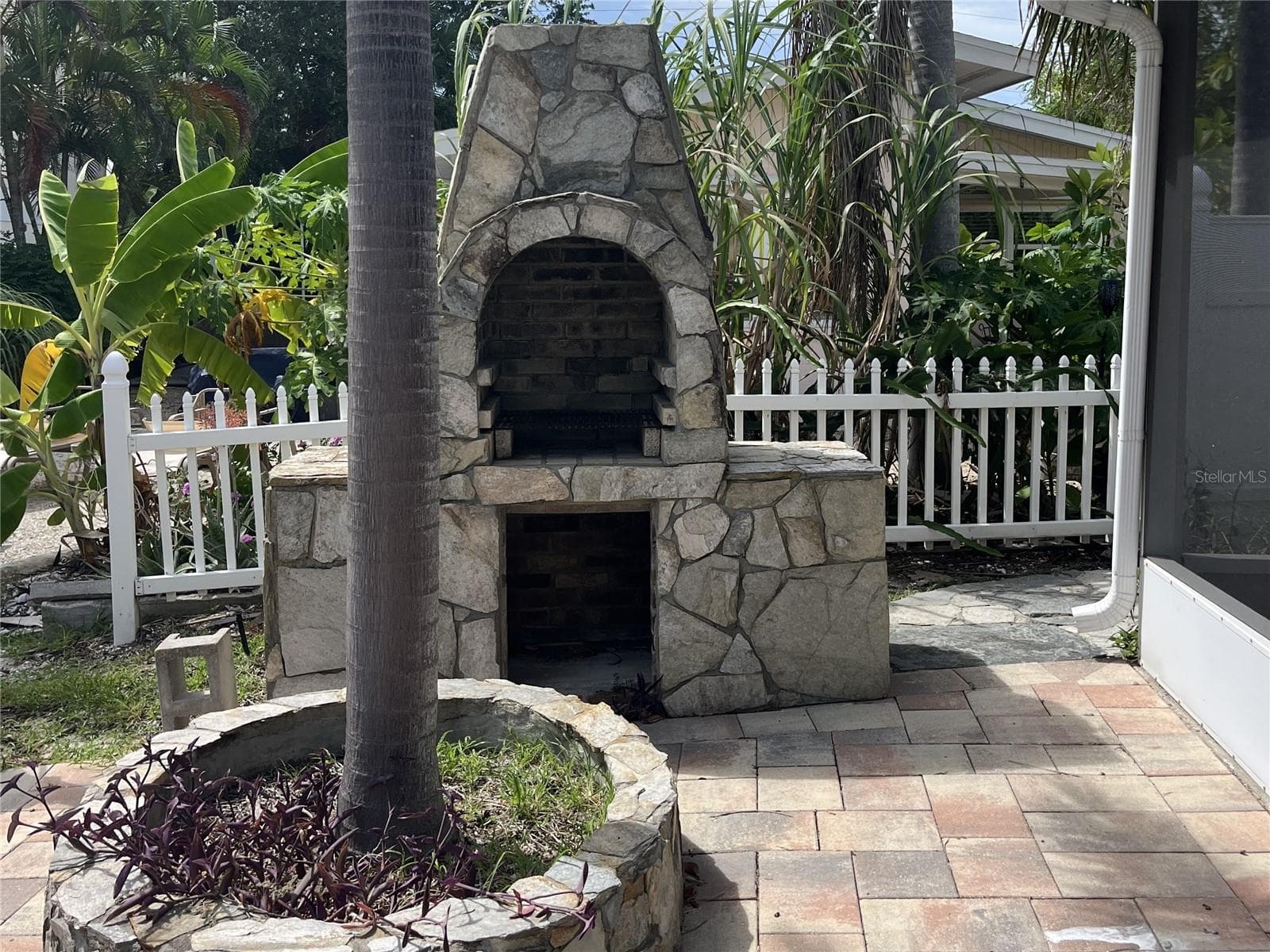 Outdoor stone pizza oven - 307 LA HACIENDA DR, INDIAN ROCKS BEACH
