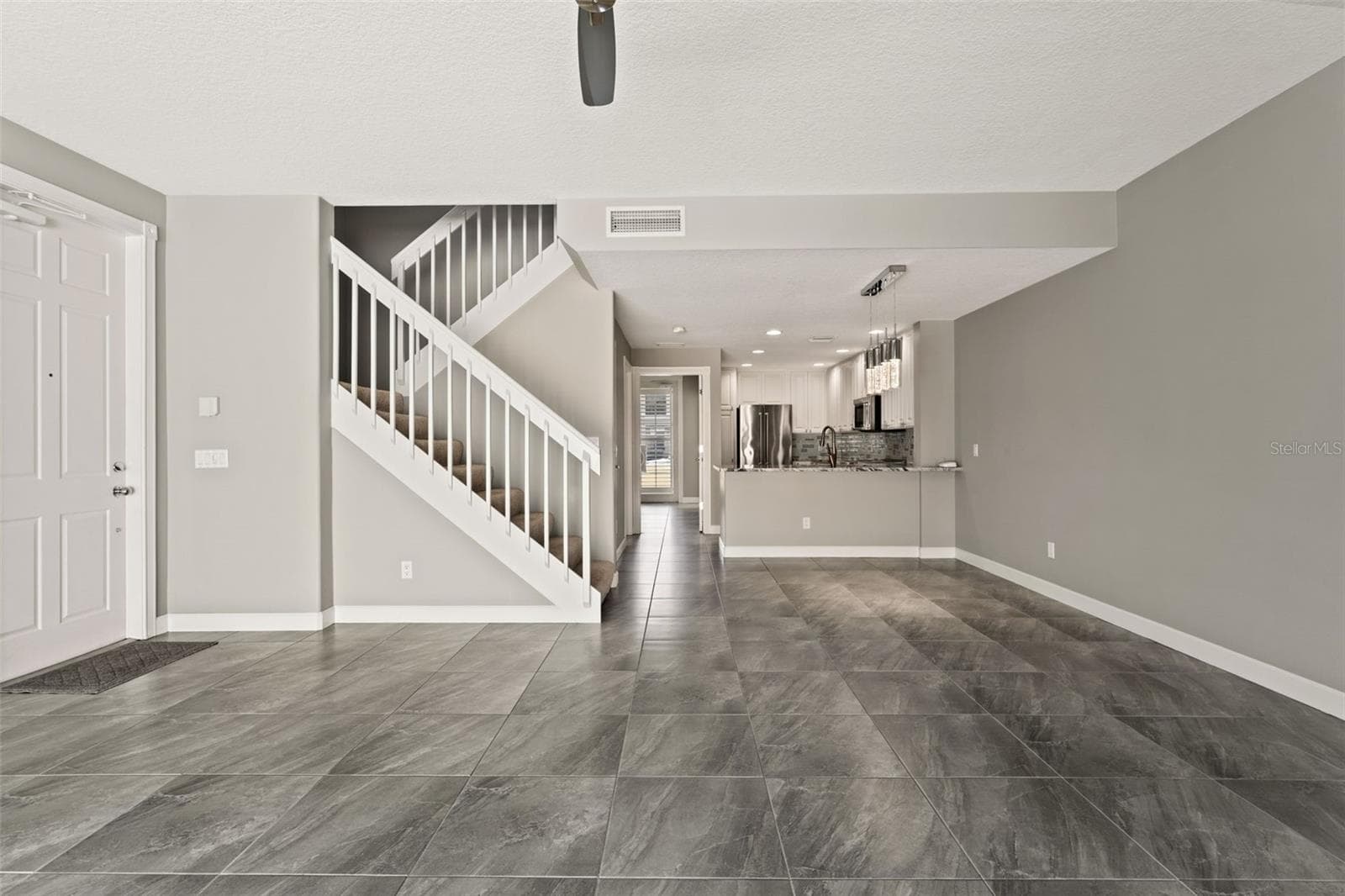 Porcelain tile flooring throughout - 5389 CAMBIAGO ST, SARASOTA