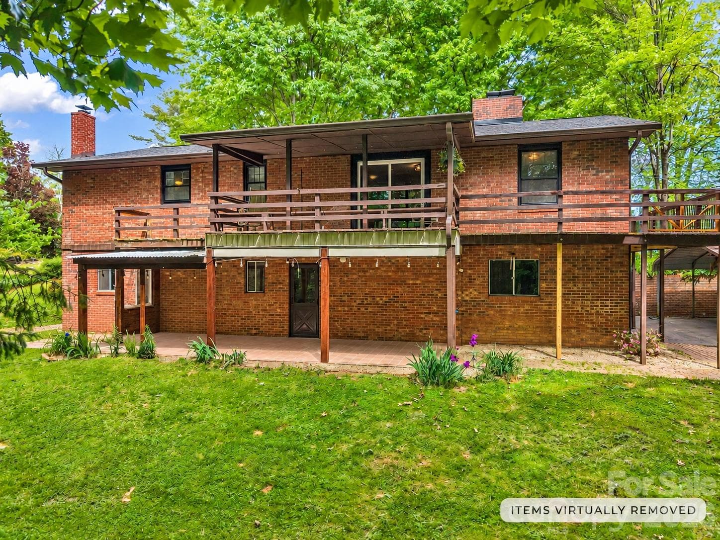 backyard with a main level deck (covered & uncovered) and a covered lower level patio. lower level has 2 private entrances! - 92 Greenwood Acres Drive, Mills River