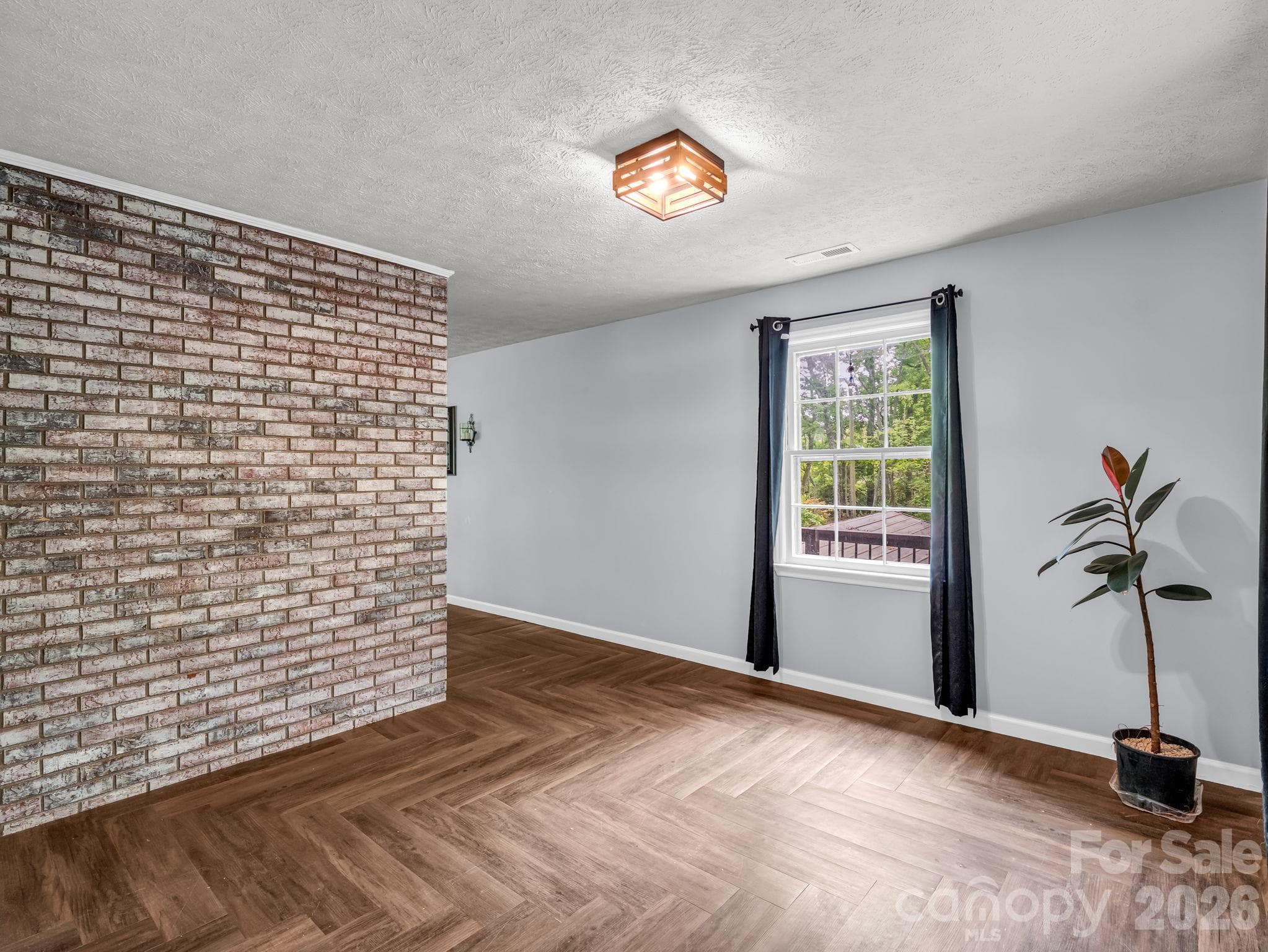 dining room with beautiful exposed brick - 92 Greenwood Acres Drive, Mills River