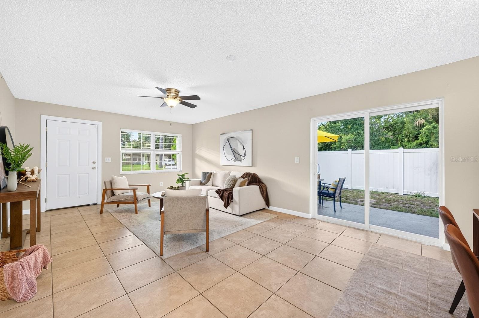Step inside to discover an OPEN FLOOR PLAN filled with NATURAL LIGHT, creating an easy flow between the Living Room and Dining Room. - 543 HIBISCUS WAY #9C, ORLANDO