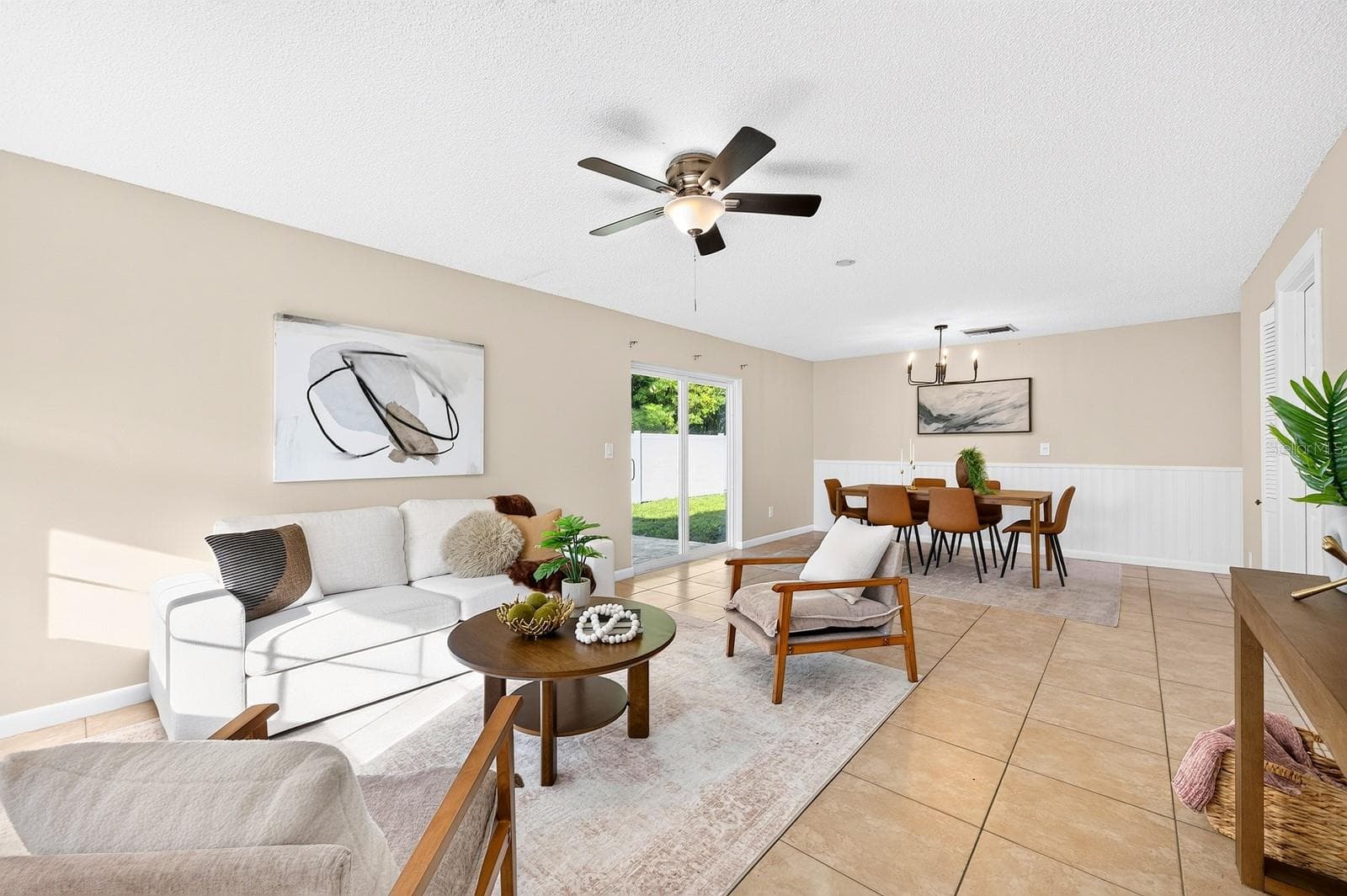 The Living Room flows effortlessly into the Dining Room. - 543 HIBISCUS WAY #9C, ORLANDO