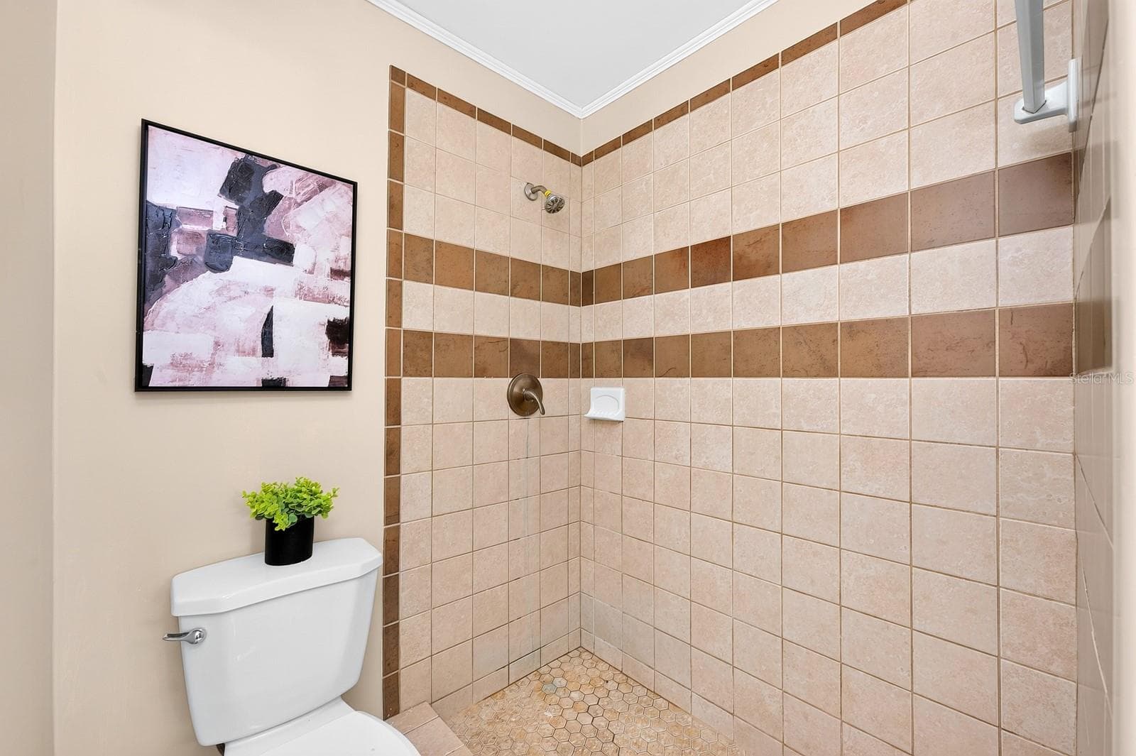 The step-in shower in the Primary en suite Bath - 543 HIBISCUS WAY #9C, ORLANDO