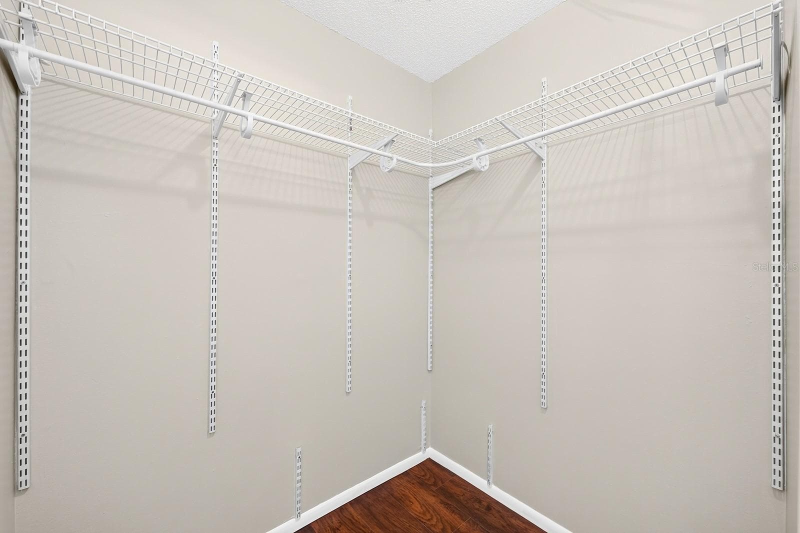 The spacious walk-in closet in the Primary Suite - 543 HIBISCUS WAY #9C, ORLANDO