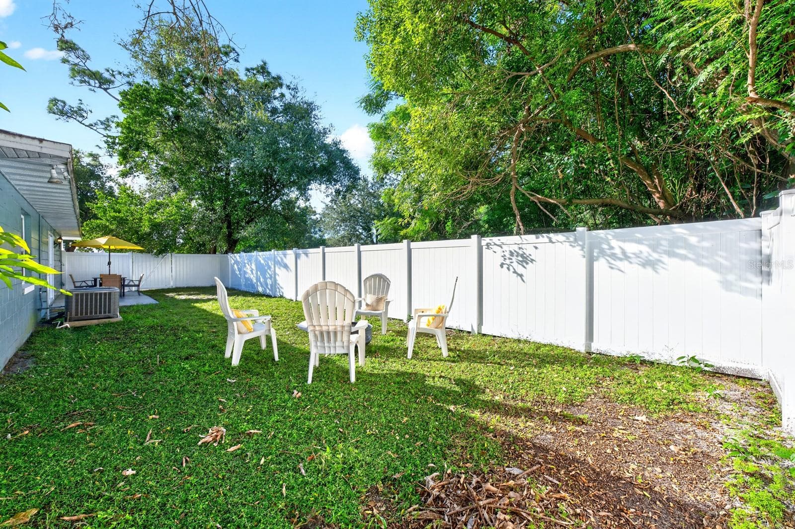 The GENEROUS YARD provides room to garden, entertain or simply enjoy a little extra space. - 543 HIBISCUS WAY #9C, ORLANDO