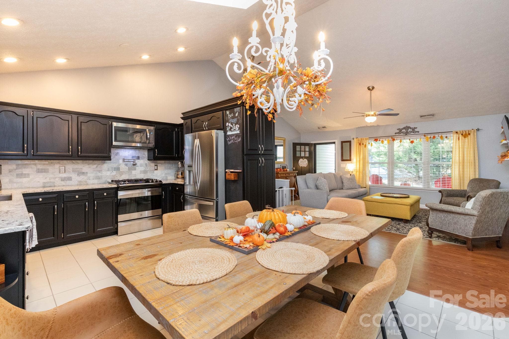 Open-concept kitchen, dining, and living areas offer a connected layout ideal for everyday living and entertaining. - 139 Lone Eagle Lane, Hendersonville