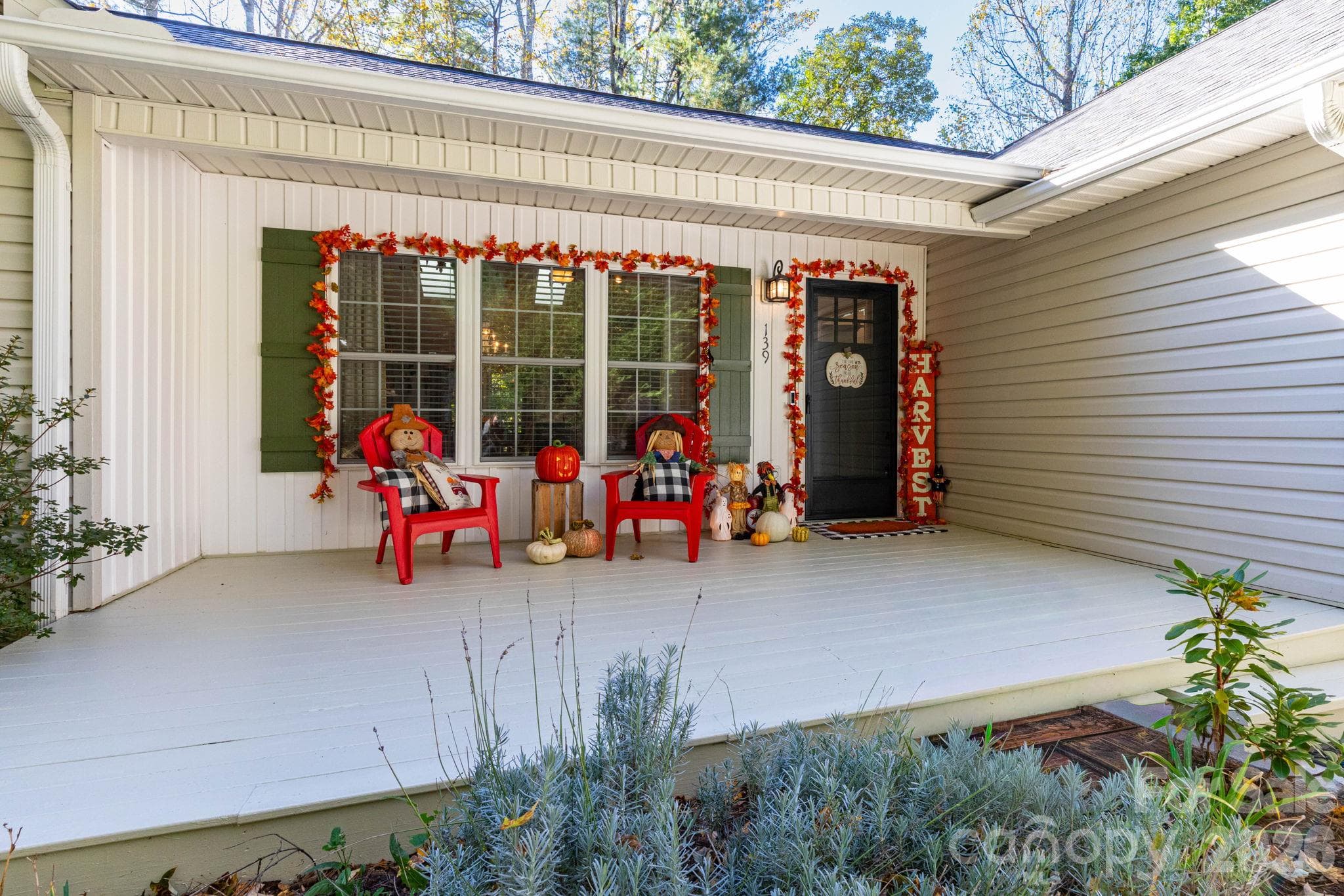 Covered front porch offers a welcoming entrance and space to relax overlooking the front yard. - 139 Lone Eagle Lane, Hendersonville