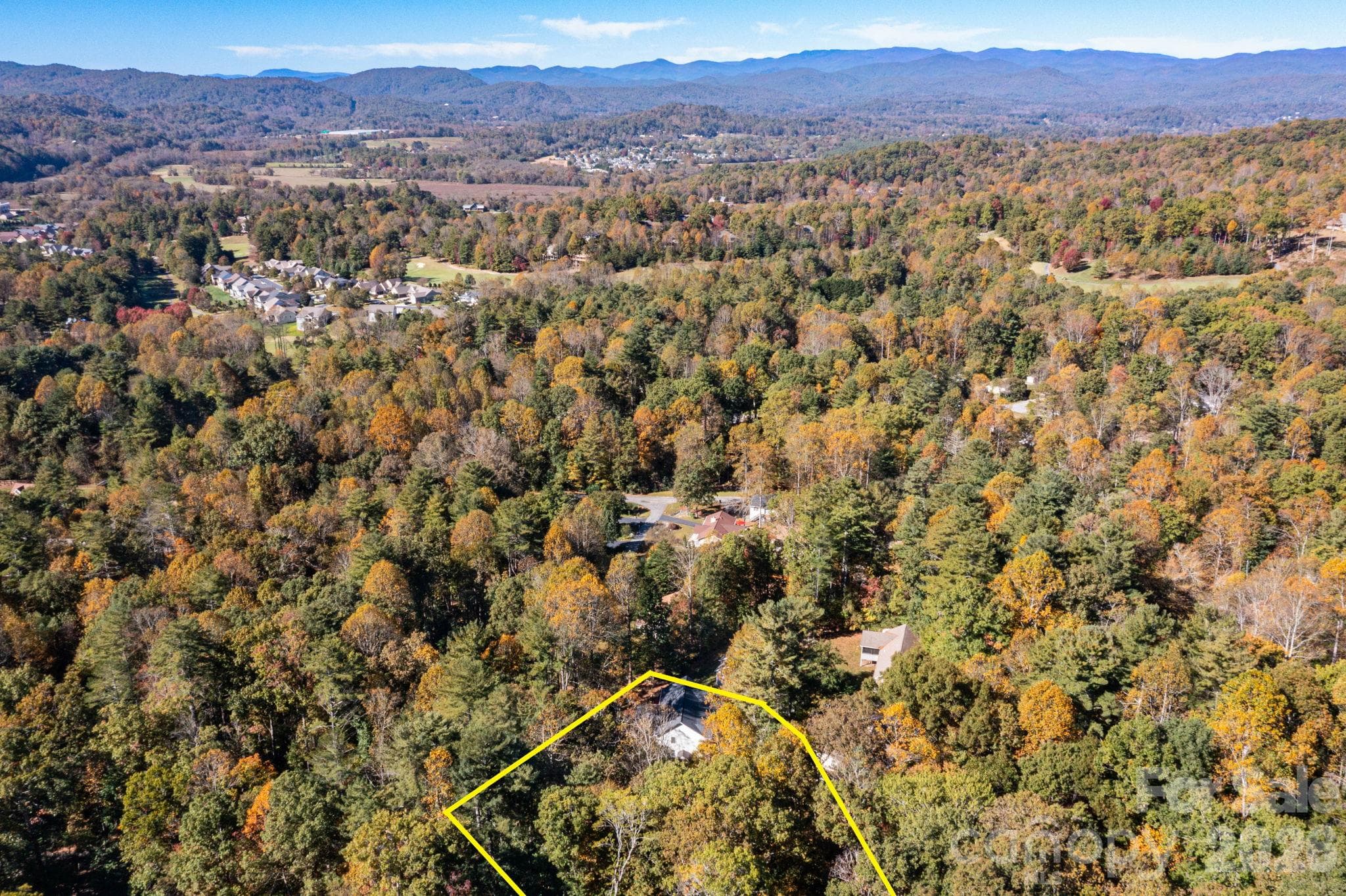 Wide aerial showing the property’s location within the surrounding valley and mountain landscape, with approximate boundaries outlined for reference. - 139 Lone Eagle Lane, Hendersonville