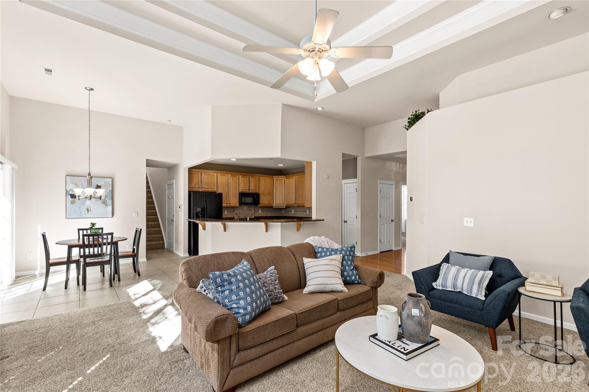 Great room with views into kitchen and breakfast room - 3820 Planters Watch Drive, Charlotte