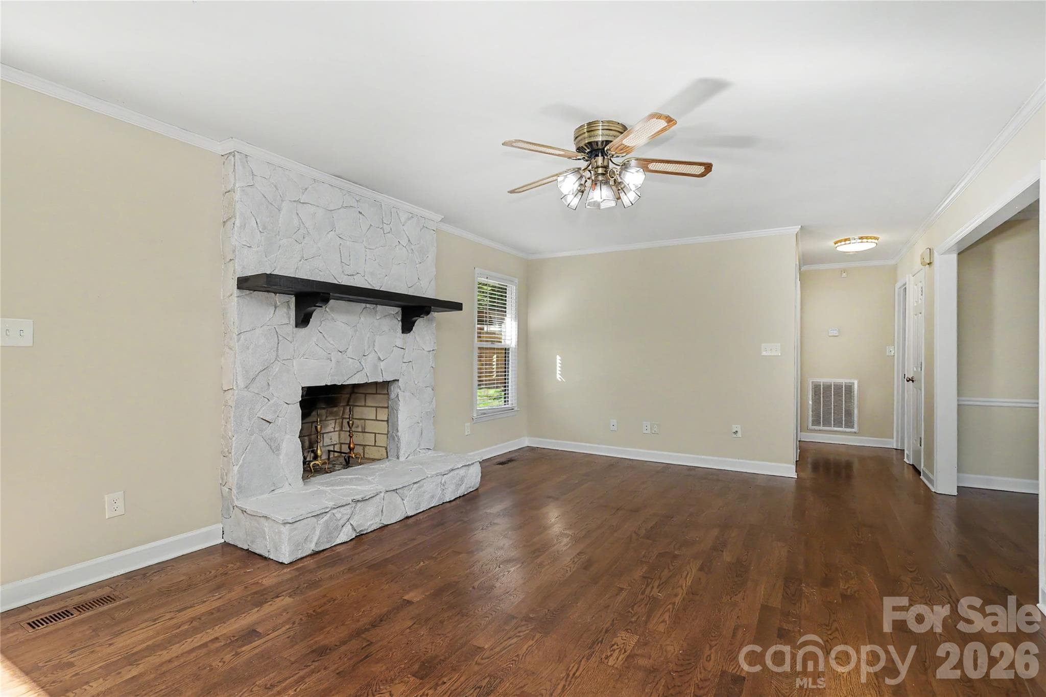 More...Living Room showing ceiling fan with lights and entry to 2 bedrooms. - 3121 Lakeside Circle, Belmont