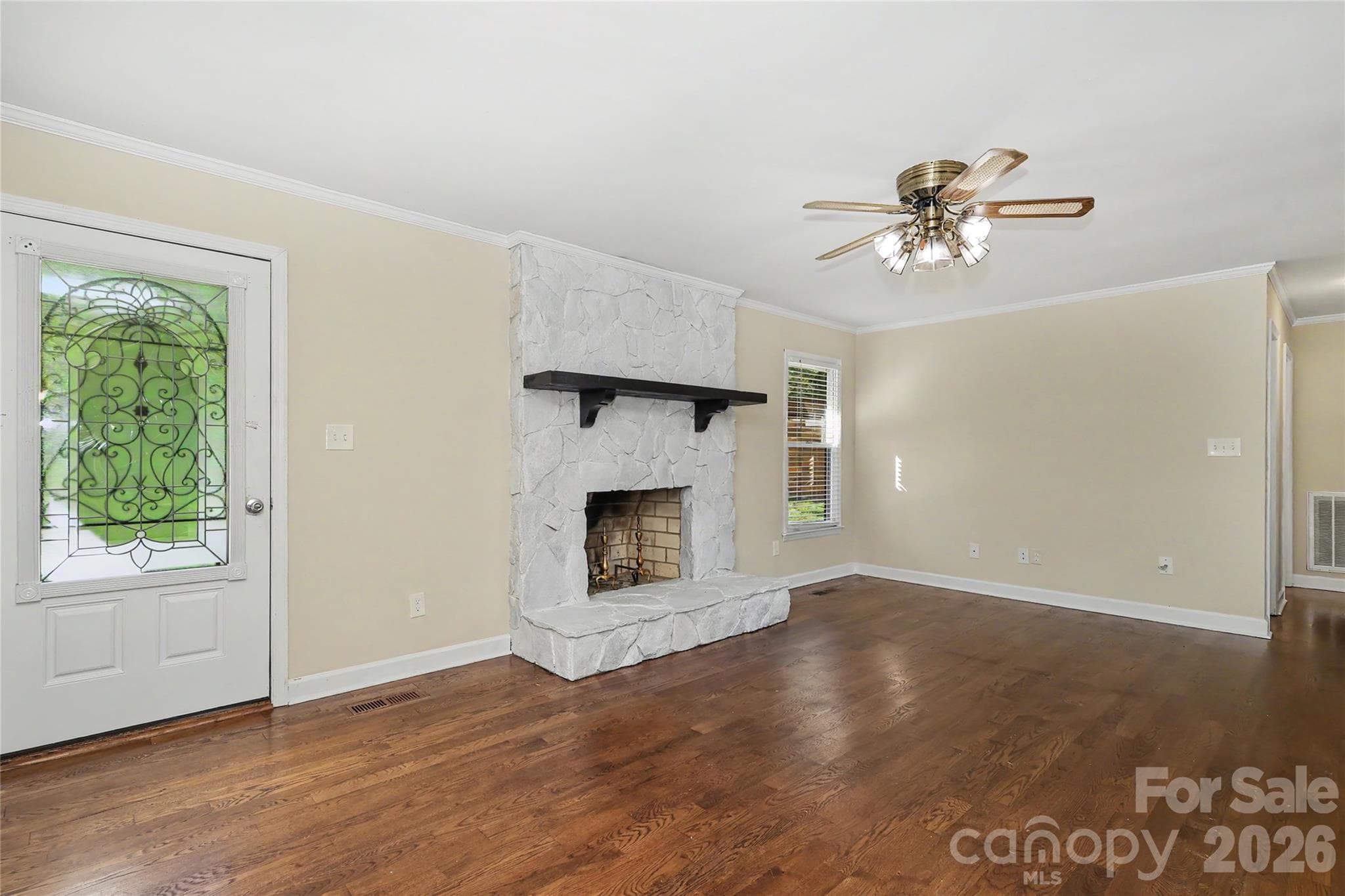 More Living Room showing front door and fireplace - 3121 Lakeside Circle, Belmont