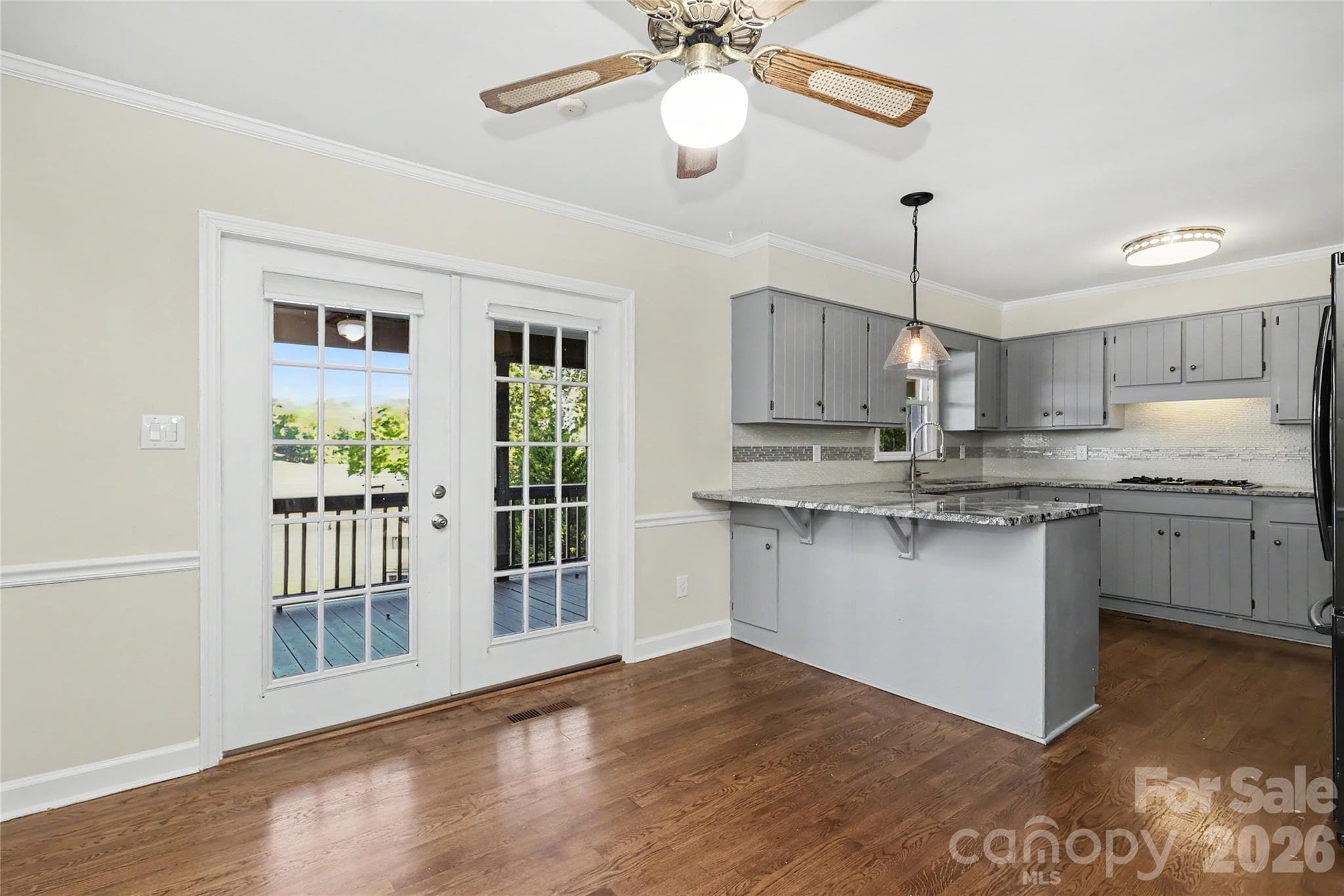 Kitchen has french doors to back deck and hardwood flooring - 3121 Lakeside Circle, Belmont