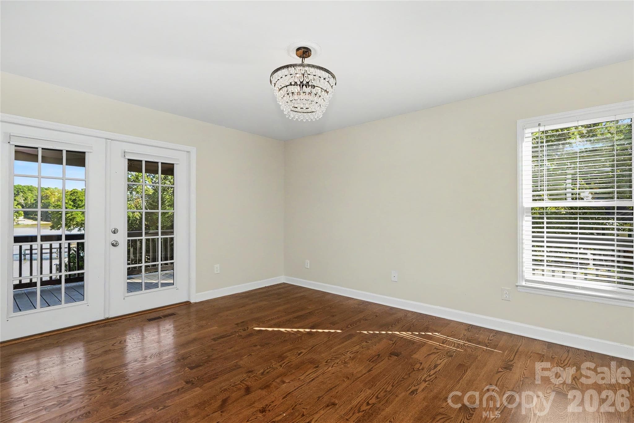 Primary Bedroom with French Doors leading to rear deck - 3121 Lakeside Circle, Belmont