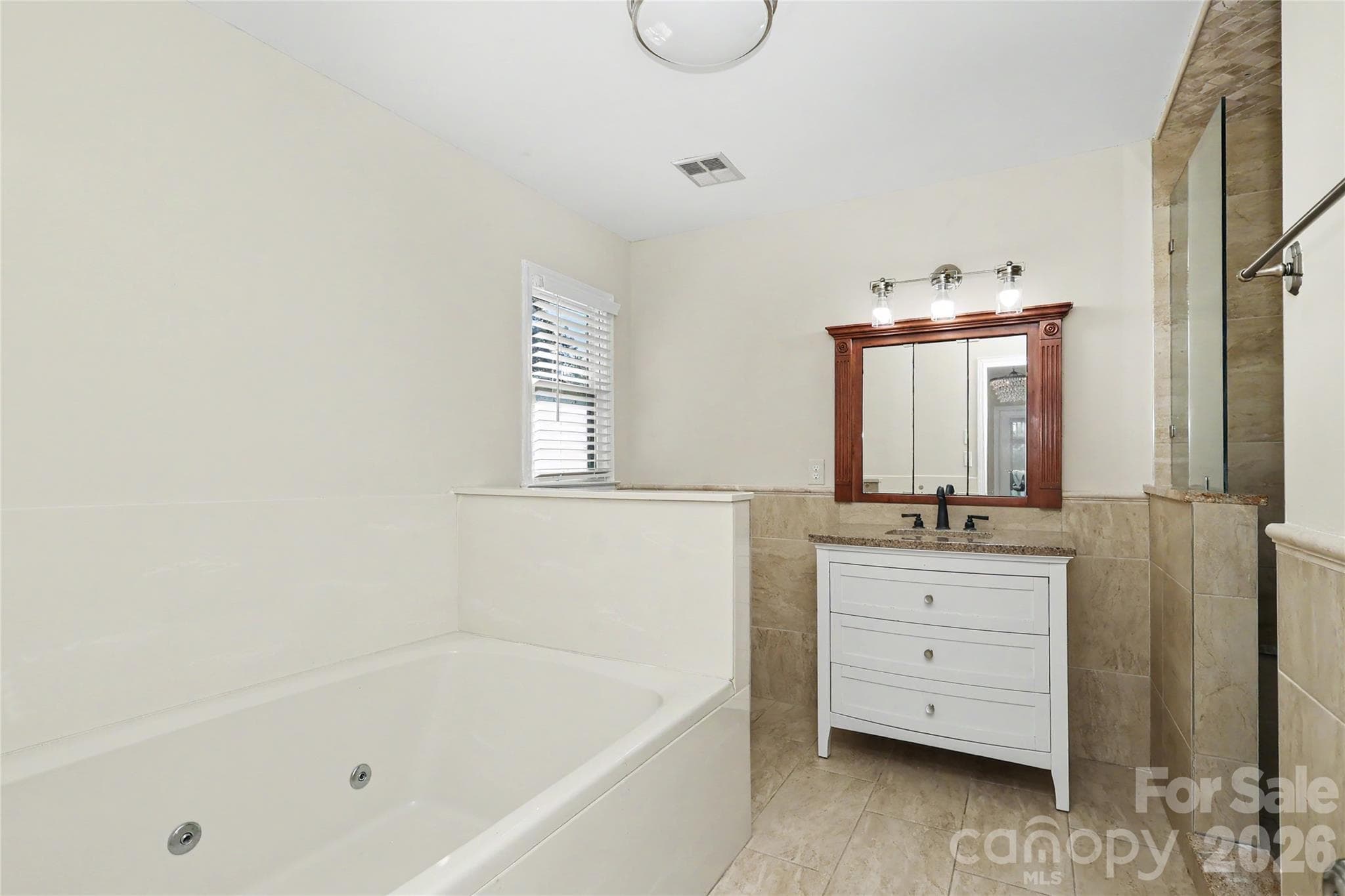 Primary Bath with jetted tub, sink and tiled shower - 3121 Lakeside Circle, Belmont