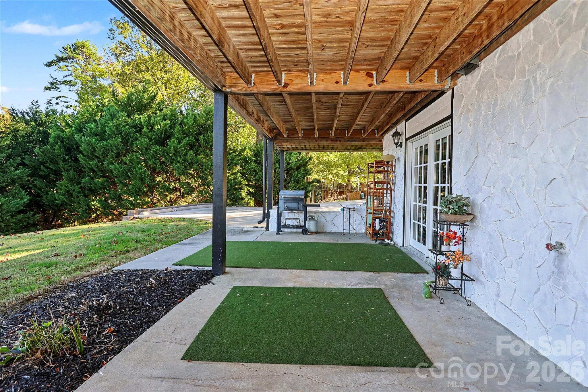 Lower Level Patio area.  Runs the full length of the home! - 3121 Lakeside Circle, Belmont