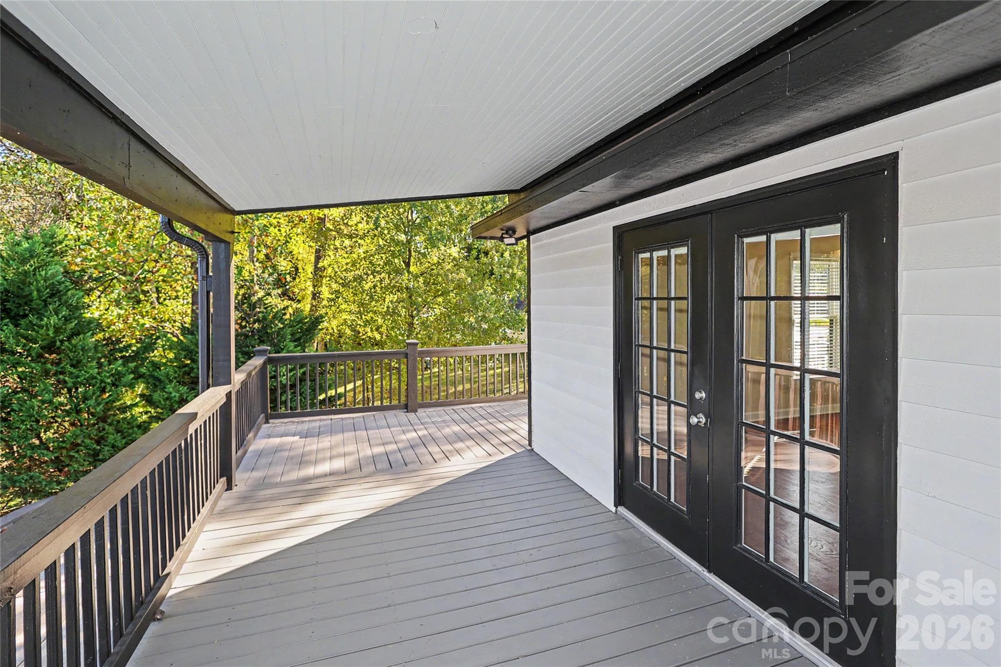 The upper porch runs the entire length of the home.  Beautiful views here of the backyard and lake. - 3121 Lakeside Circle, Belmont