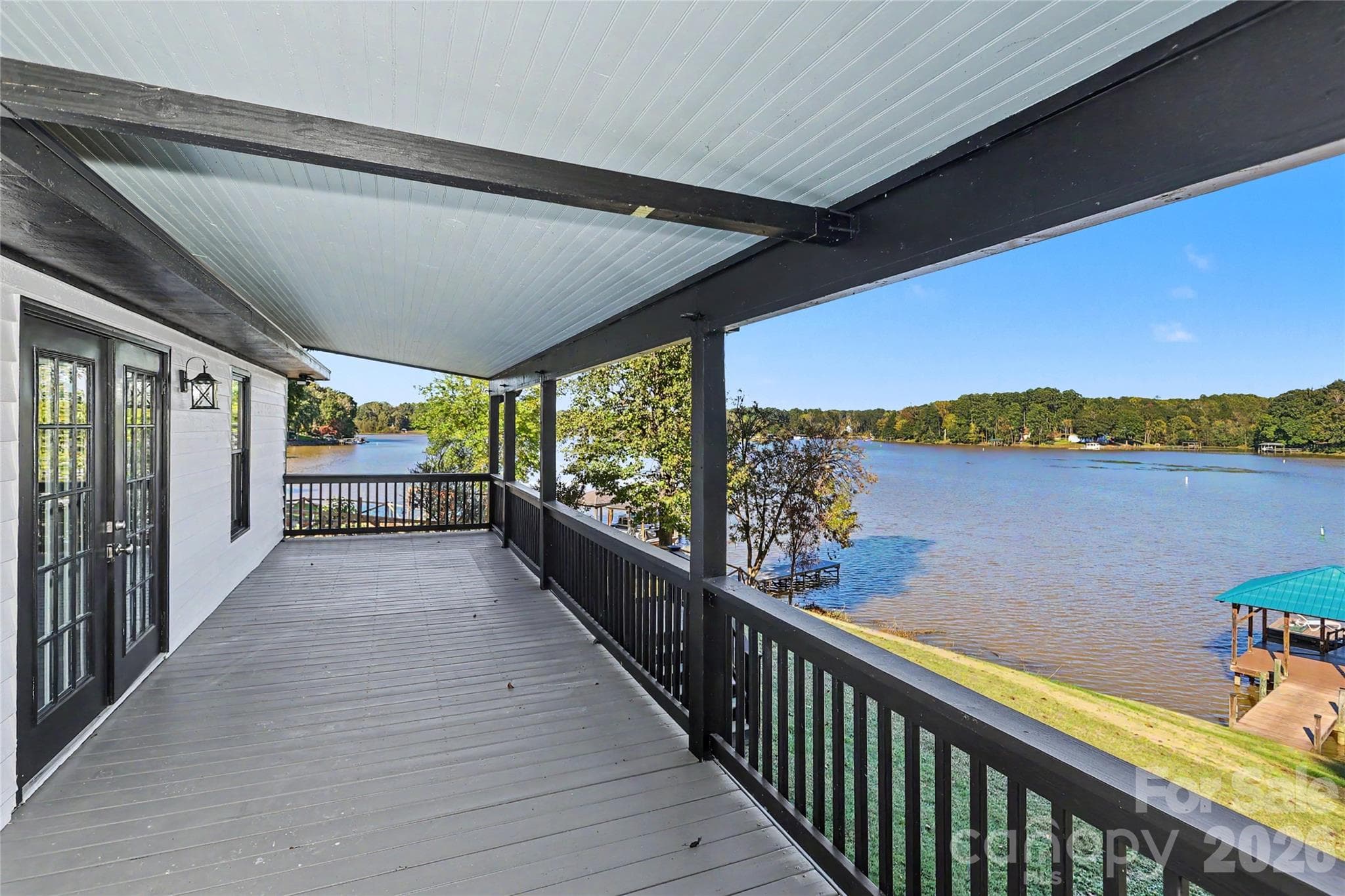 Main level porch showing the view of the water - 3121 Lakeside Circle, Belmont