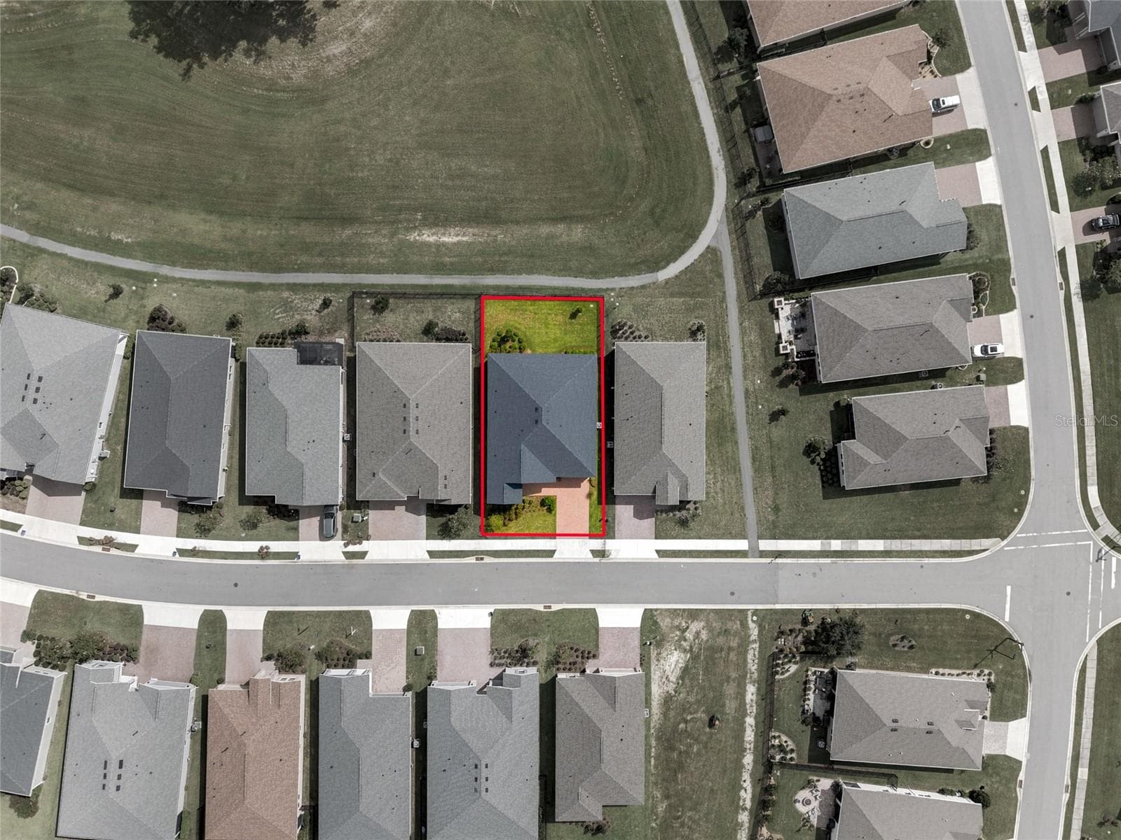 Property boundaries highlighted in red, showing the location of the home and its backyard. - 4497 NW 54TH TER, OCALA
