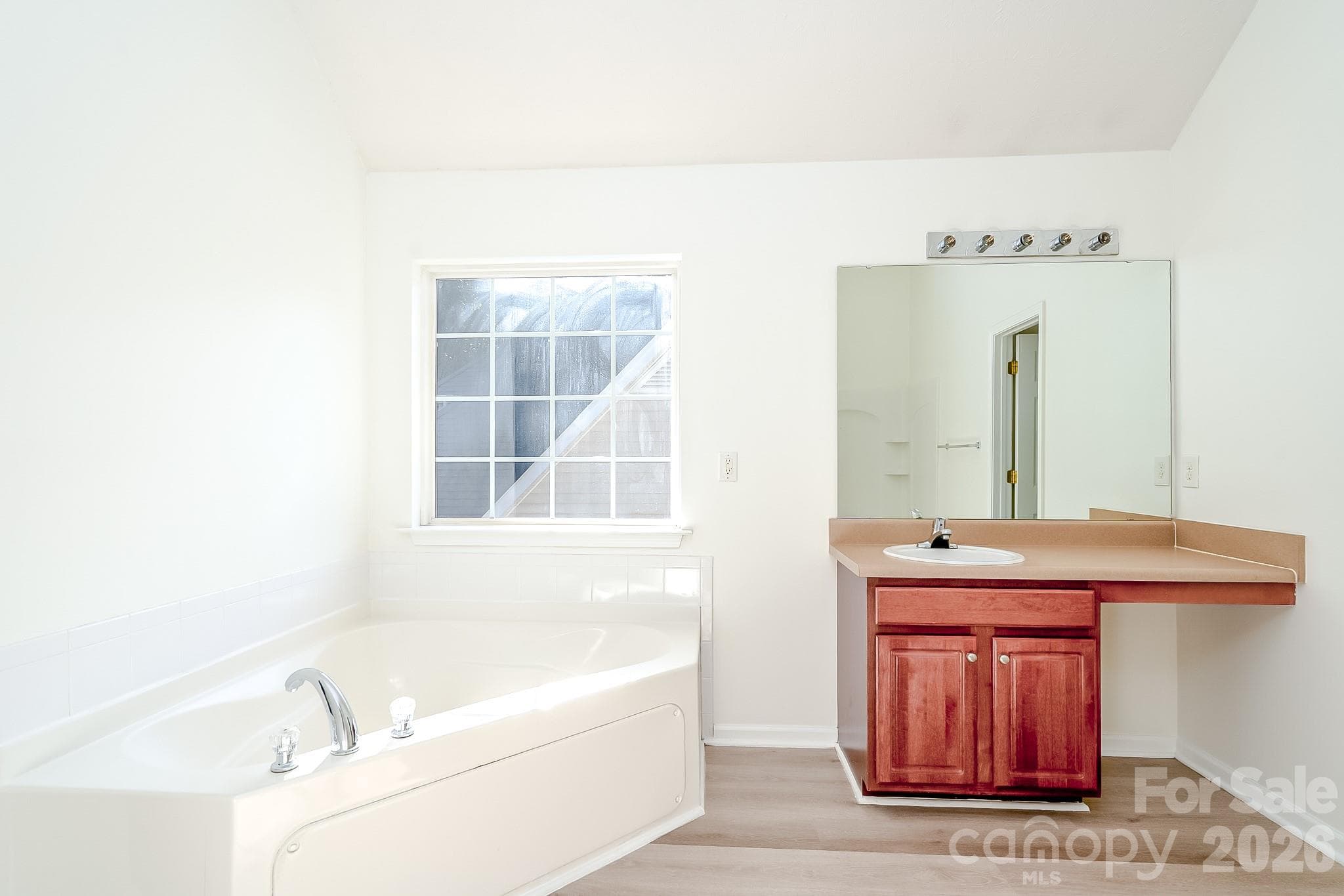 Primary bathroom with garden tub and separate shower - 5124 Eagle Creek Drive, Charlotte