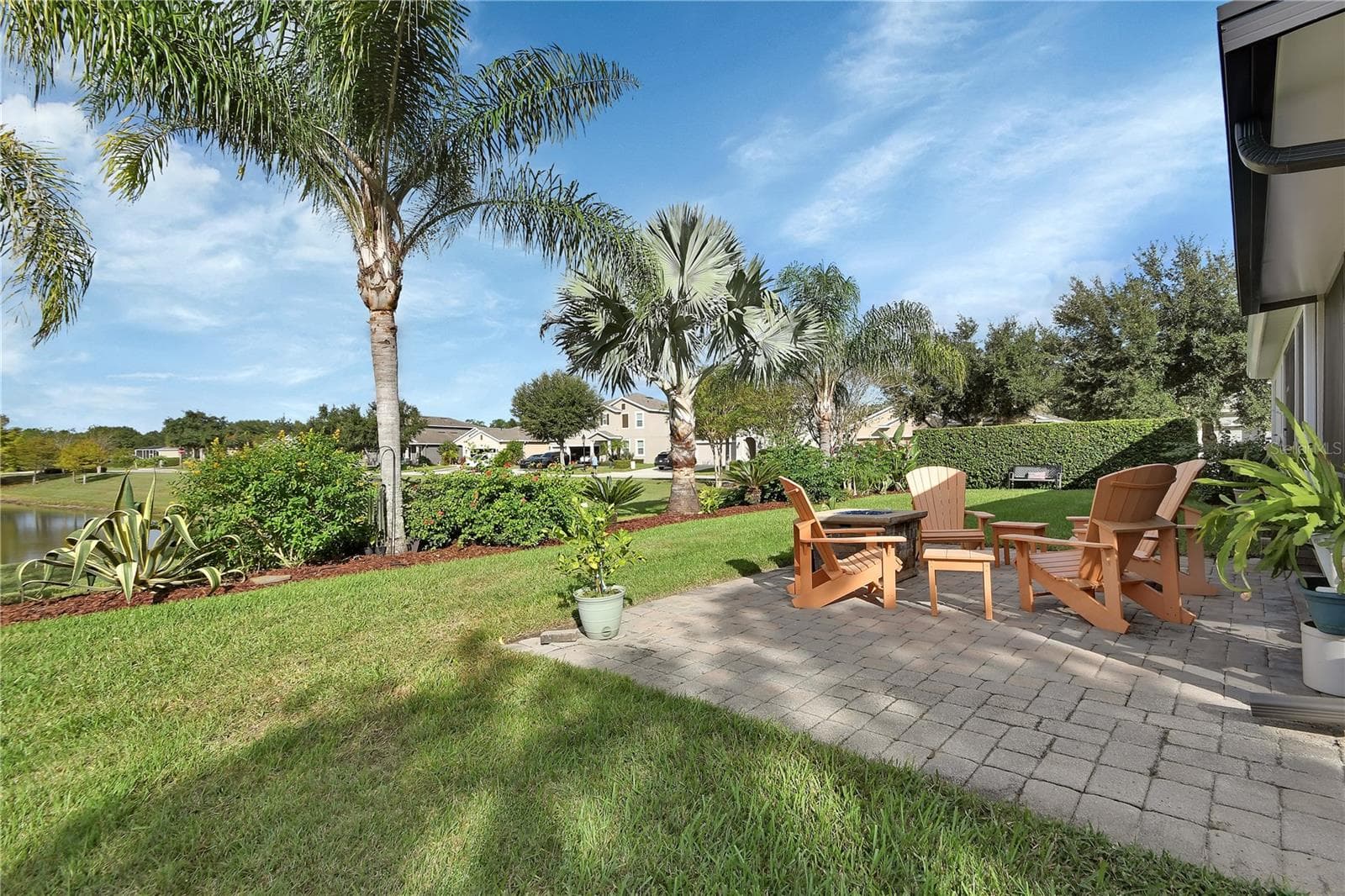 Paver patio with water and garden view - 126 MYRTLEBERRY LN, DELAND