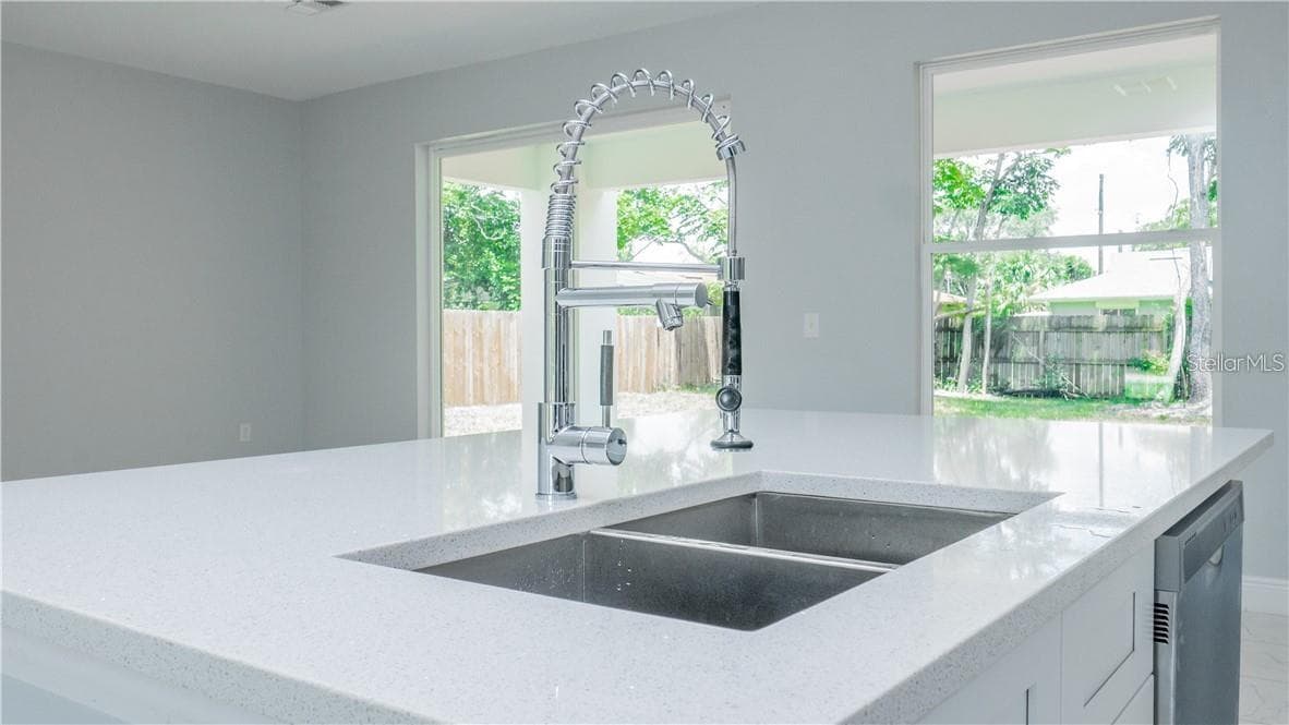 Kitchen sink and island - 2916 WINLOCK AVE, DELTONA