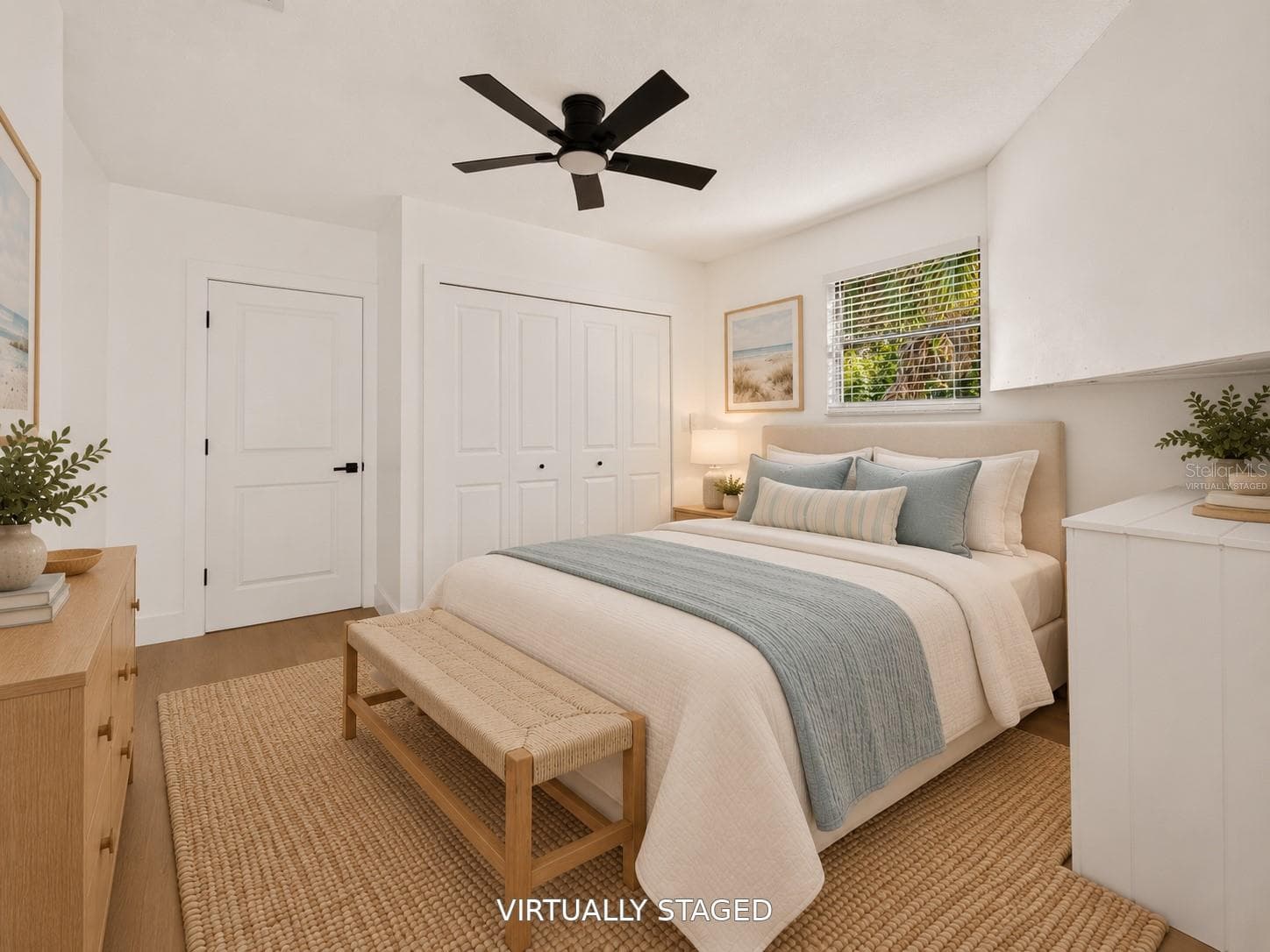 VIRTUALLY STAGED. Additional bedroom featuring a sleek black ceiling fan and updated flooring. - 16107 SEA PINES DR, HUDSON