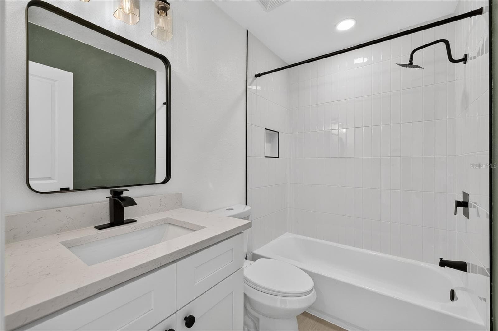 Conveniently located guest bathroom with a clean, functional layout. - 16107 SEA PINES DR, HUDSON