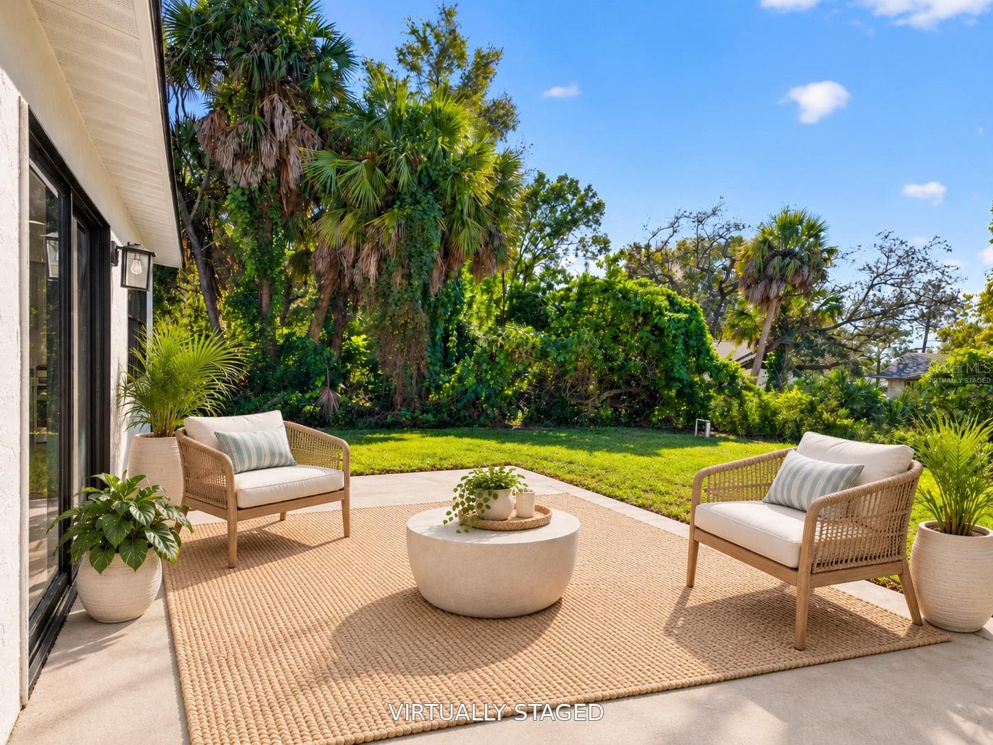 VIRTUALLY STAGED. Imagine morning coffee or evening conversations on your private patio. - 16107 SEA PINES DR, HUDSON