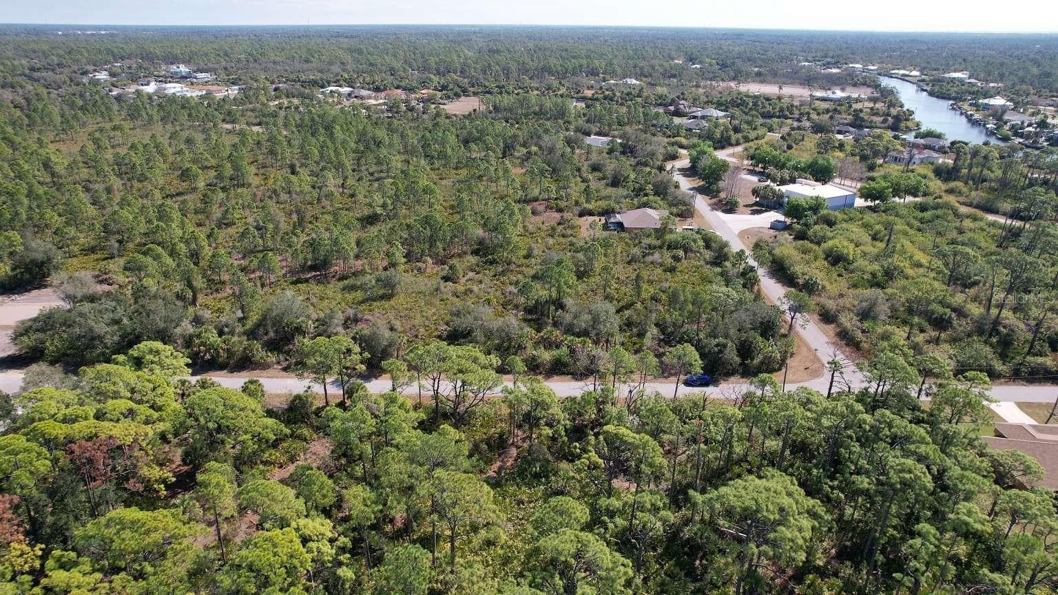 Aerial view of surrounding area; nearby water is not part of the property. - 1262 SANFORD ST, PORT CHARLOTTE