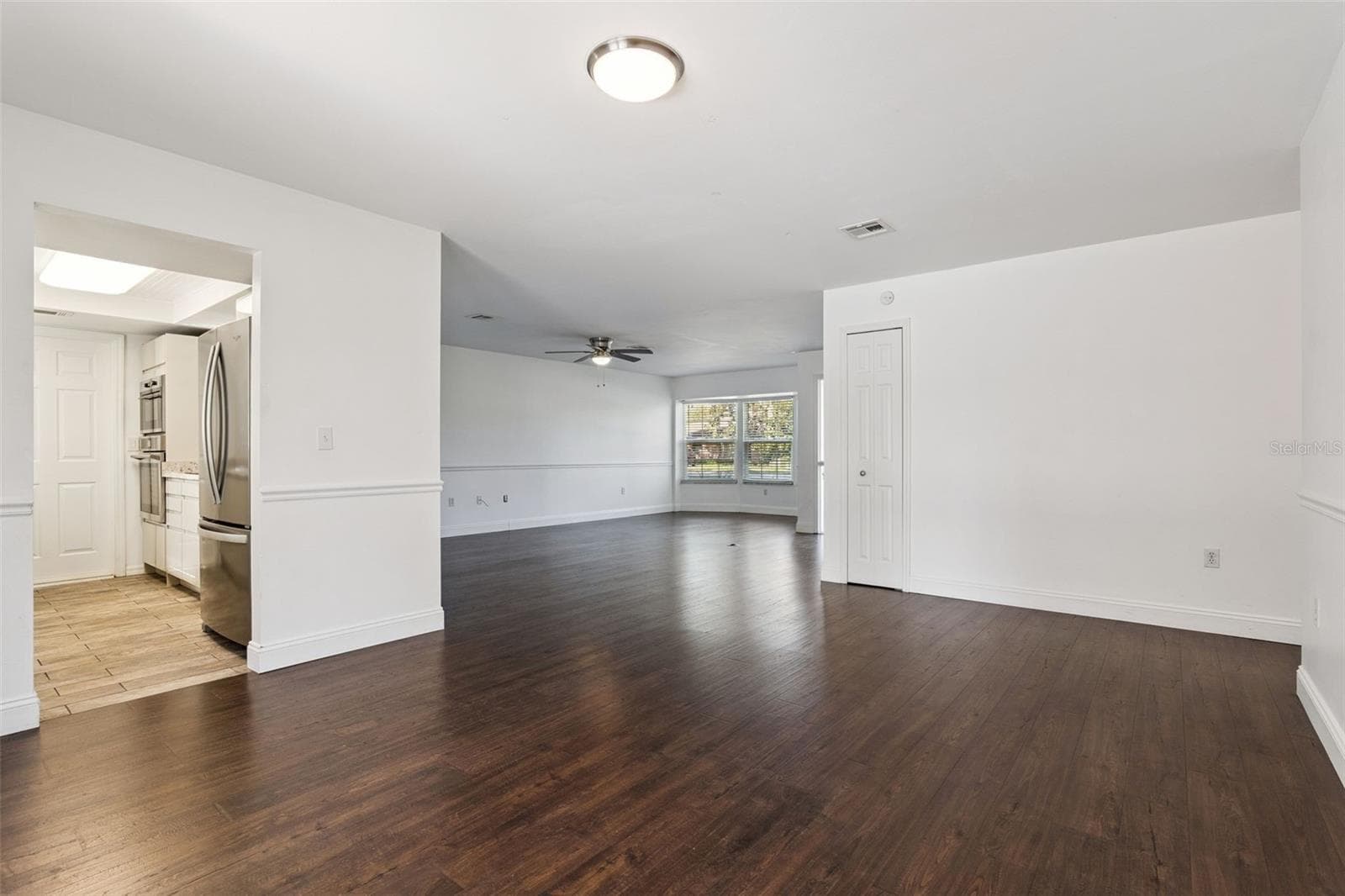 Easy flow from the living area to the kitchen - 5246 ROYAL OAK DR, FRUITLAND PARK