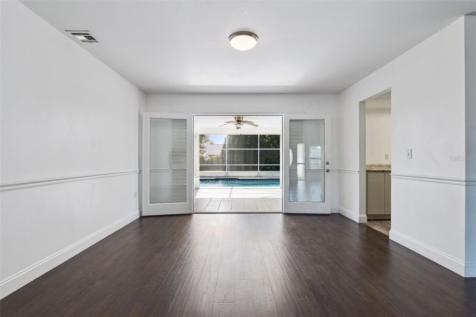 French doors open right onto the pool view - 5246 ROYAL OAK DR, FRUITLAND PARK
