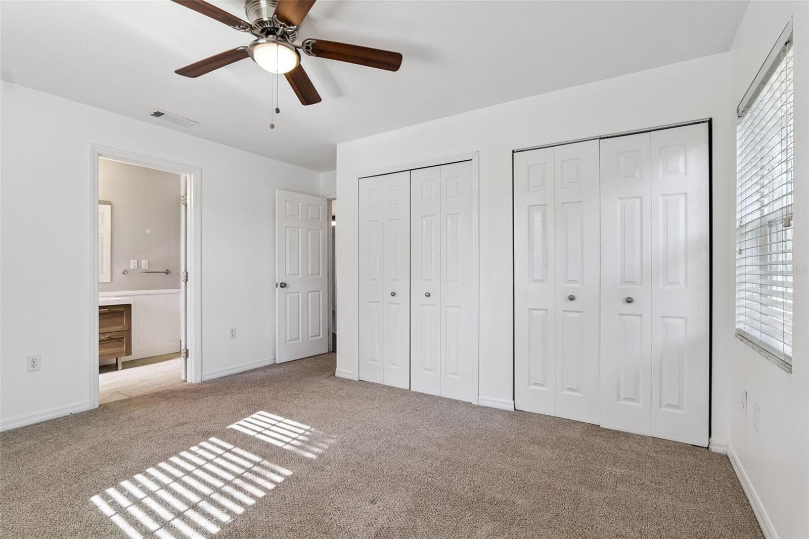 Primary bedroom with 2 closets and a private bath - 5246 ROYAL OAK DR, FRUITLAND PARK