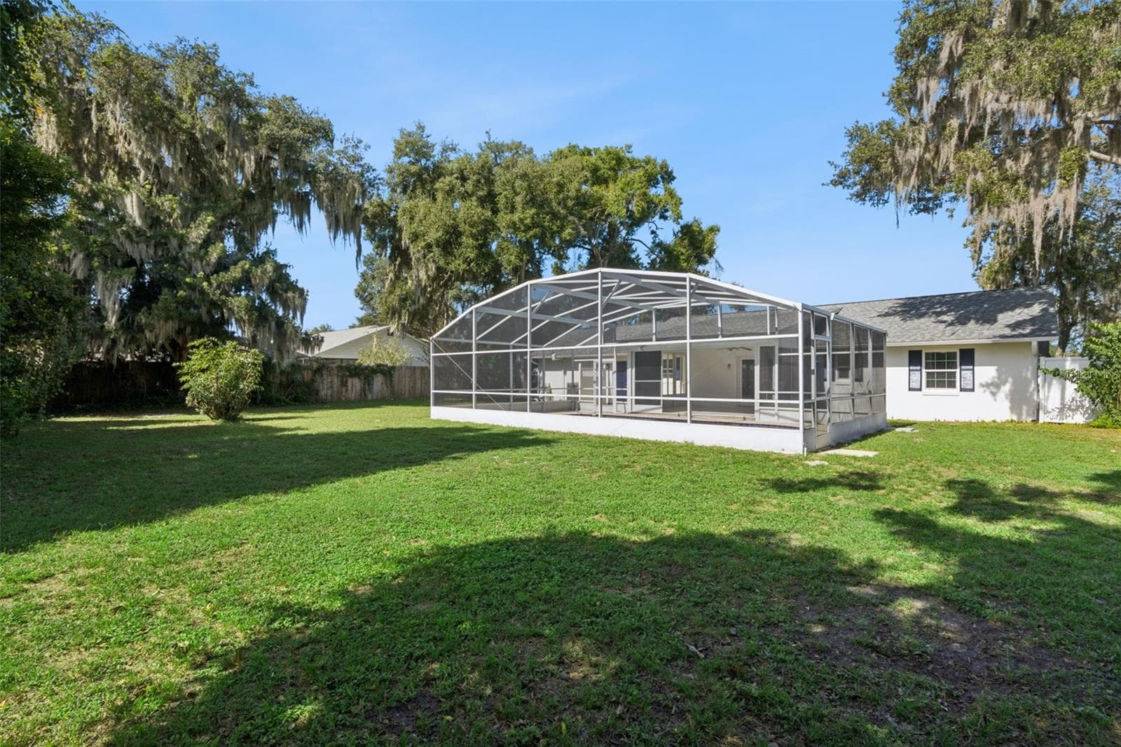 Wide open lawn under a blue Florida sky - 5246 ROYAL OAK DR, FRUITLAND PARK