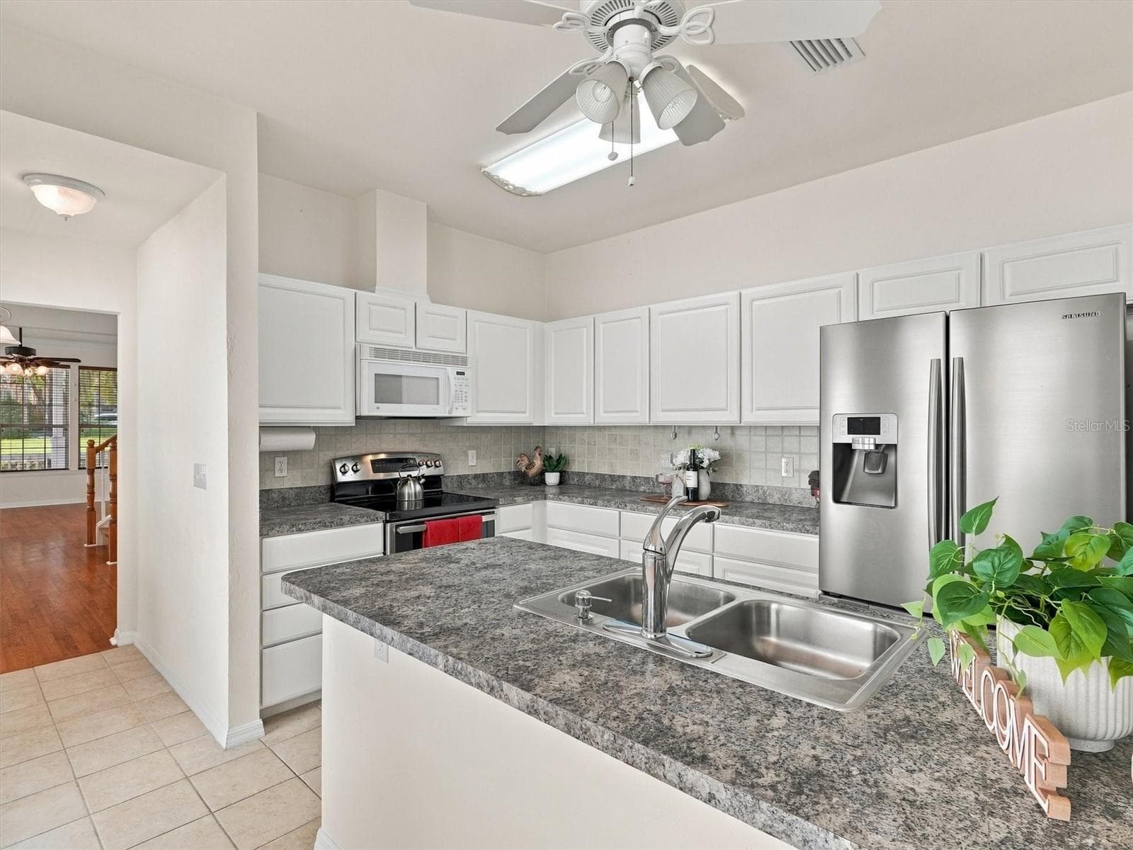 Kitchen with Stainless Steel Appliances, Laminate Countertops, and Walk in Pantry. - 11644 NW 18TH PL, GAINESVILLE