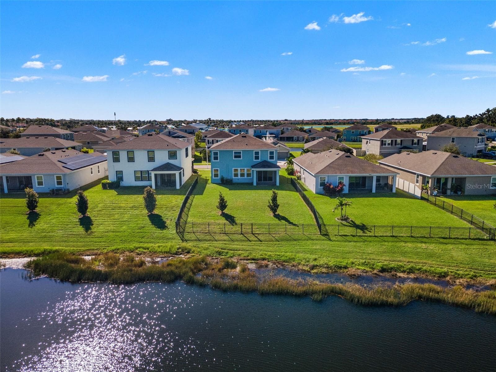 Rear aerial and pond-side yard - 5126 Jackel Chase Dr, Wimauma - 5126 JACKEL CHASE DR, WIMAUMA