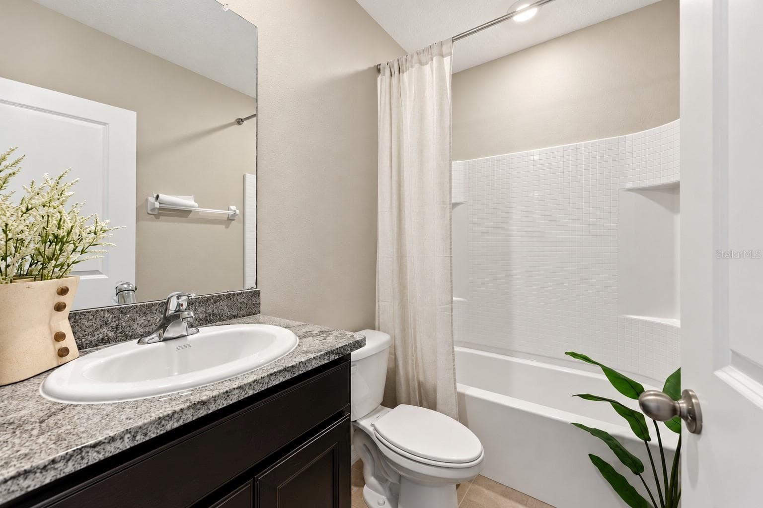 Bathroom with tub and shower - 5126 Jackel Chase Dr, Wimauma - 5126 JACKEL CHASE DR, WIMAUMA