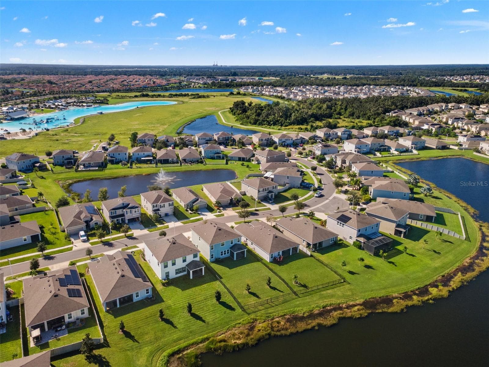 Rear neighborhood aerial with lagoon context - 5126 Jackel Chase Dr, Wimauma - 5126 JACKEL CHASE DR, WIMAUMA