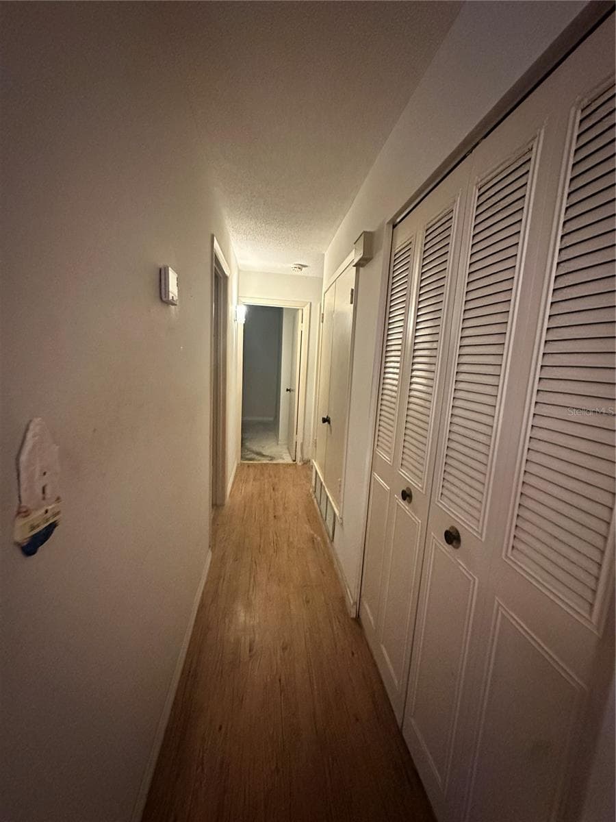 hall to bedrooms - 1554 INVERNESS ST, PORT CHARLOTTE