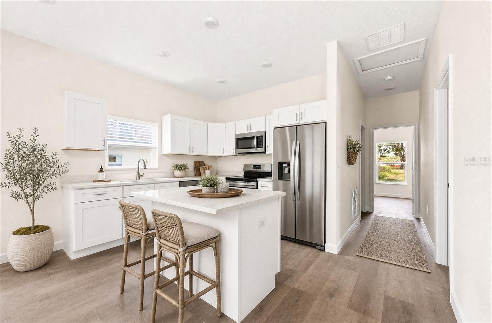 Modern open kitchen. Virtually Staged. - 702 LUCKY ST, TITUSVILLE